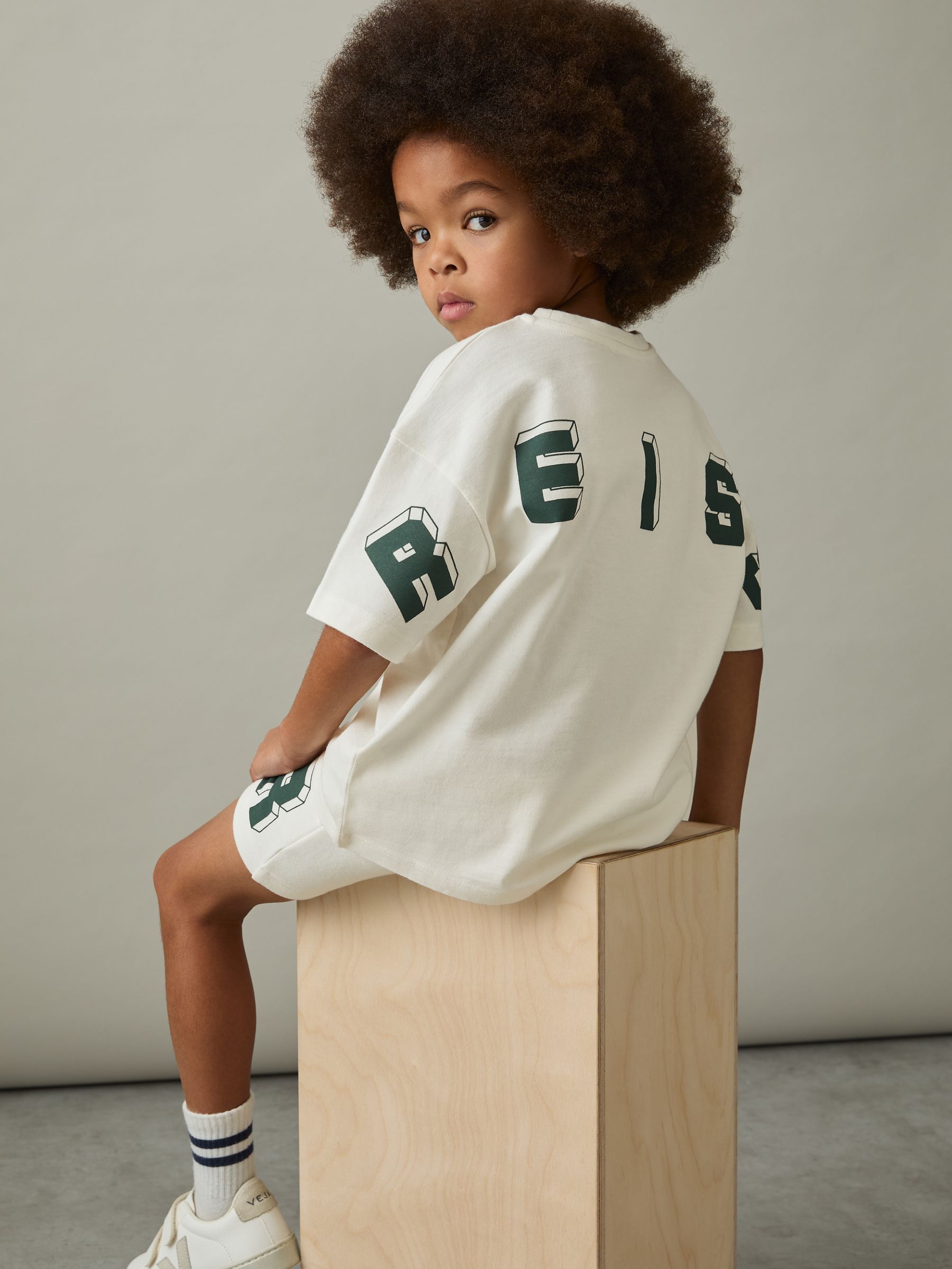 3-9 yrs Cotton Block-Logo Oversized T-Shirt in Off White/Green - Image 1 of 4 3-9 yrs Cotton Block-Logo Oversized T-Shirt in Off White/Green - Image 1 of 4