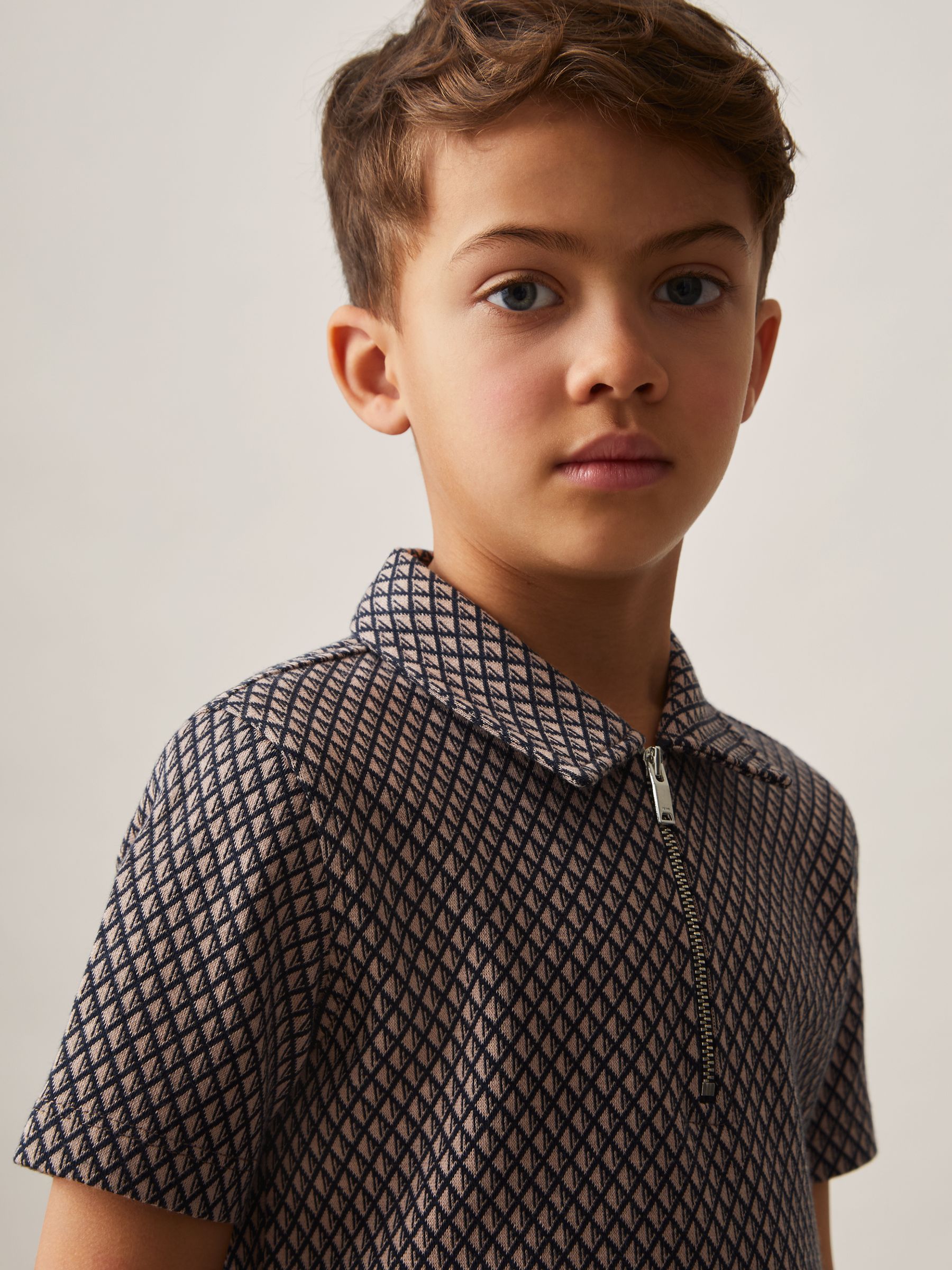 3-9 yrs Geometric Jacquard Polo Shirt in Tobacco Brown/Navy - Image 1 of 4