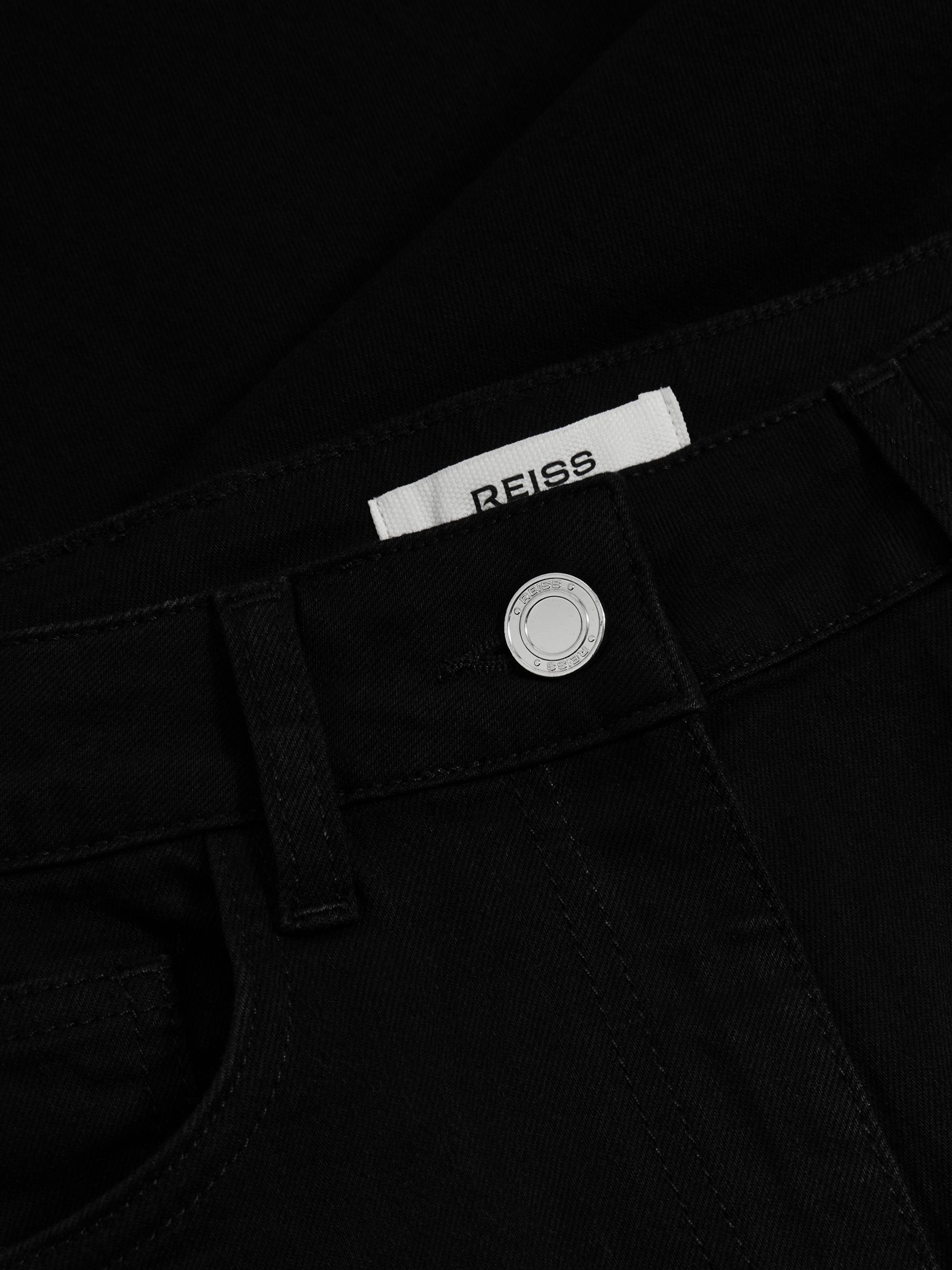 Petite Mid-Rise Flared Jeans in Black - image 4