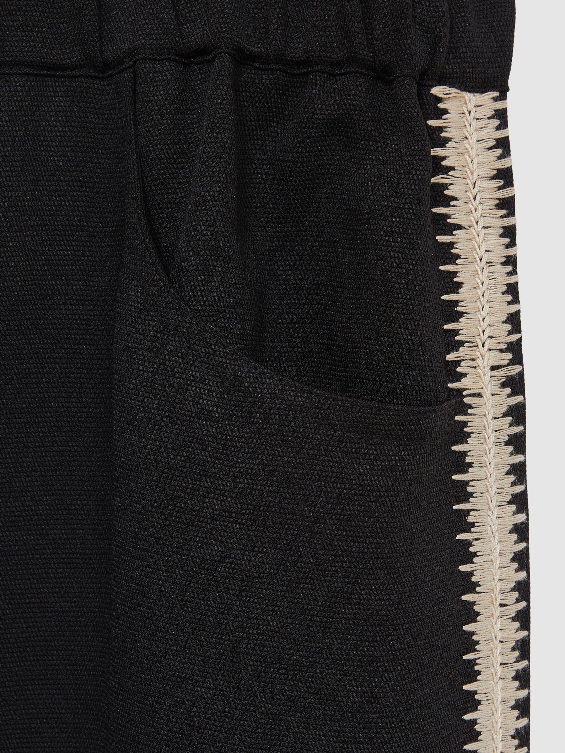 Wide-Leg Embroidered Trousers in Black - Image 6 of 6