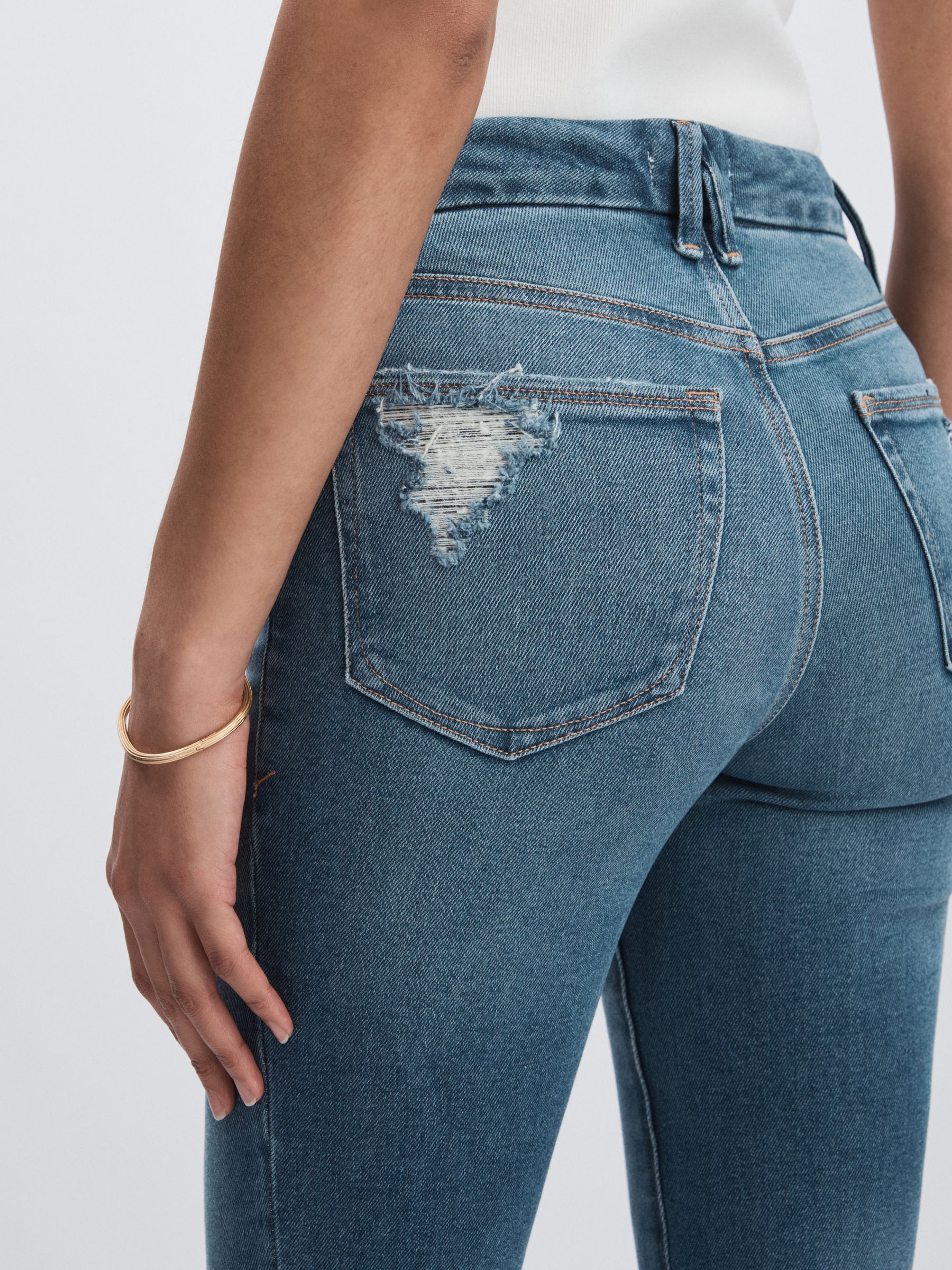 Good American Flared Distressed Jeans in Dark Indigo - Image 4 of 6