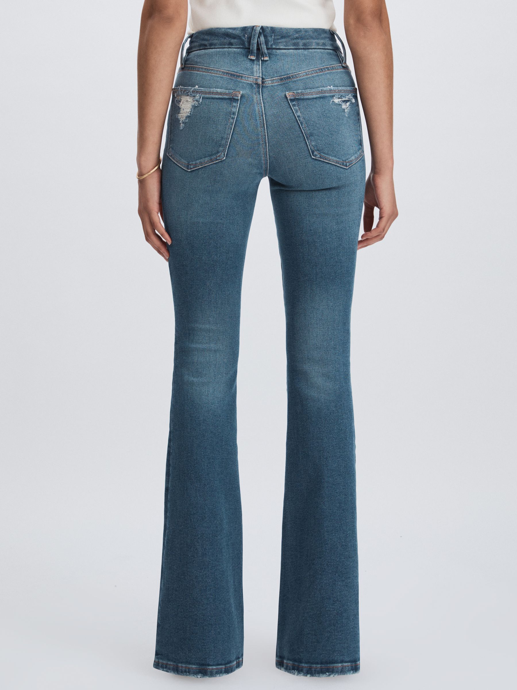 Good American Flared Distressed Jeans in Dark Indigo - Image 5 of 6