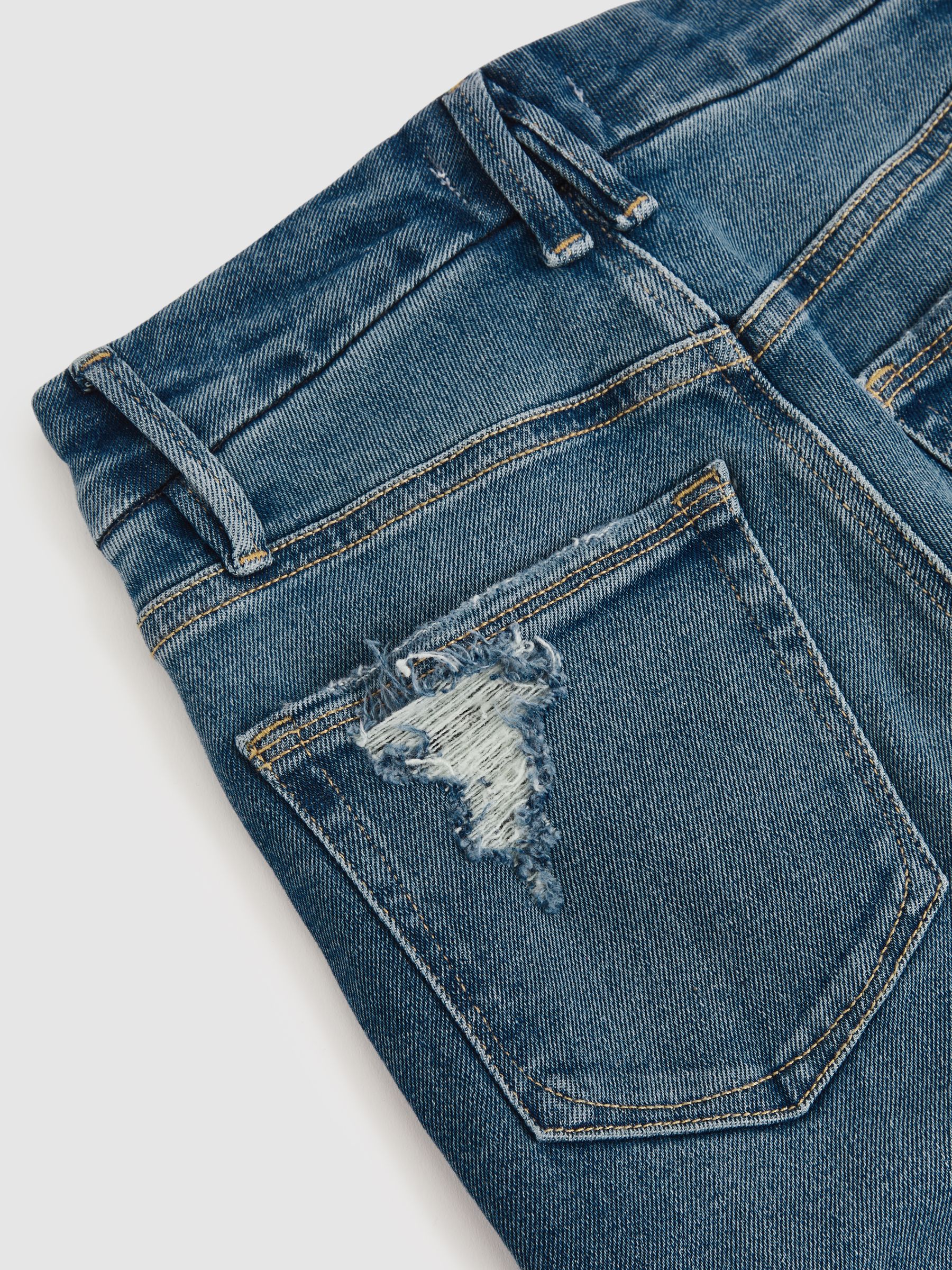 Good American Flared Distressed Jeans in Dark Indigo - Image 6 of 6