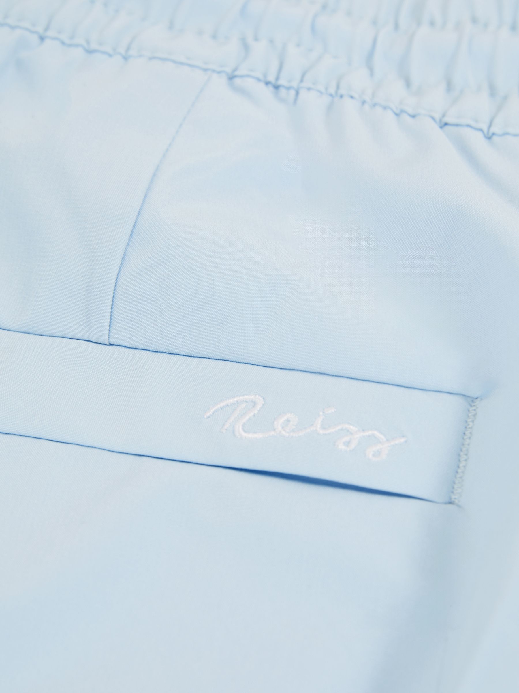 Drawstring Swim Shorts in Soft Blue - image 4