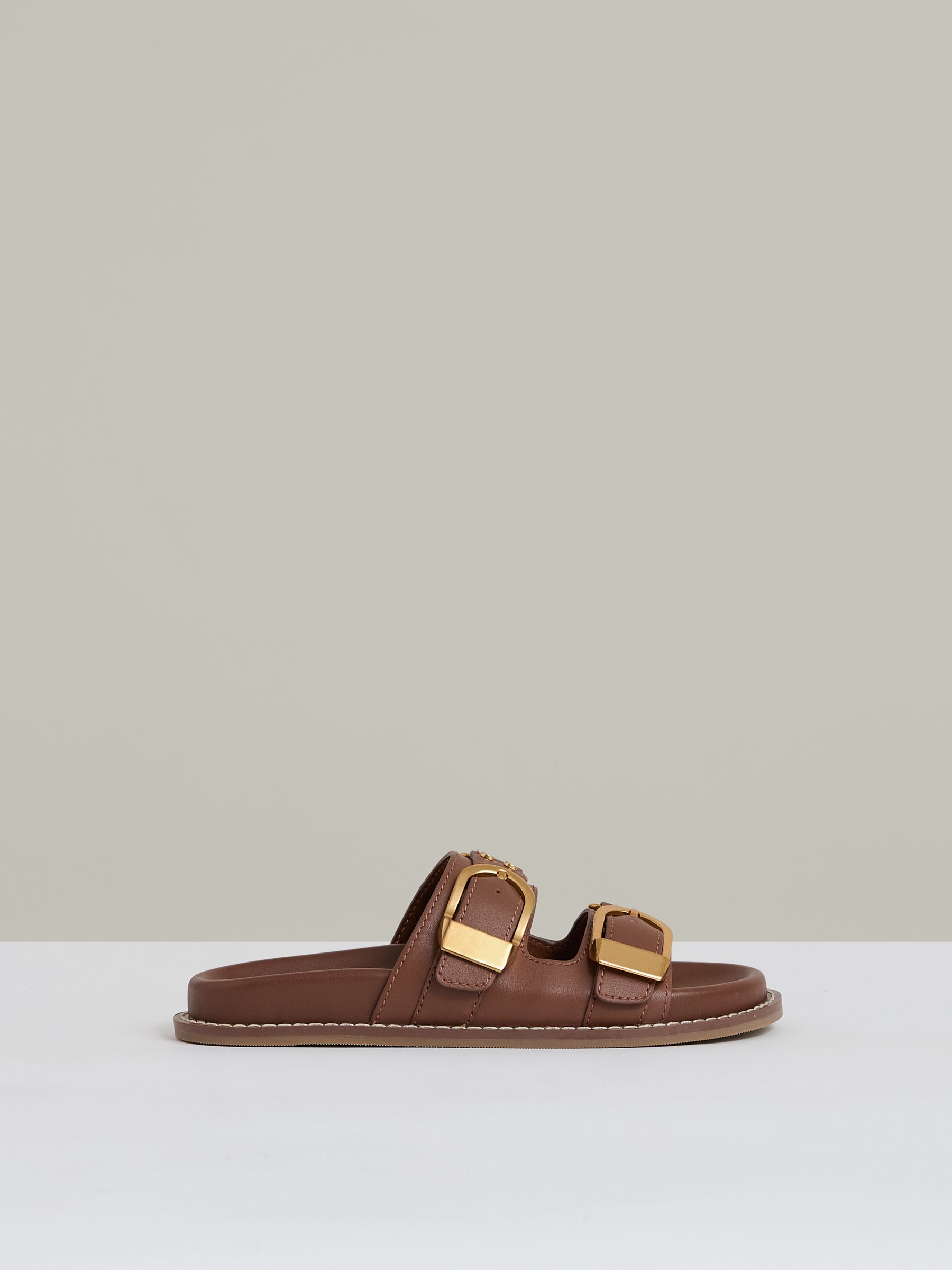 Leather Buckled Slip-On Sandals in Tan - Image 1 of 6