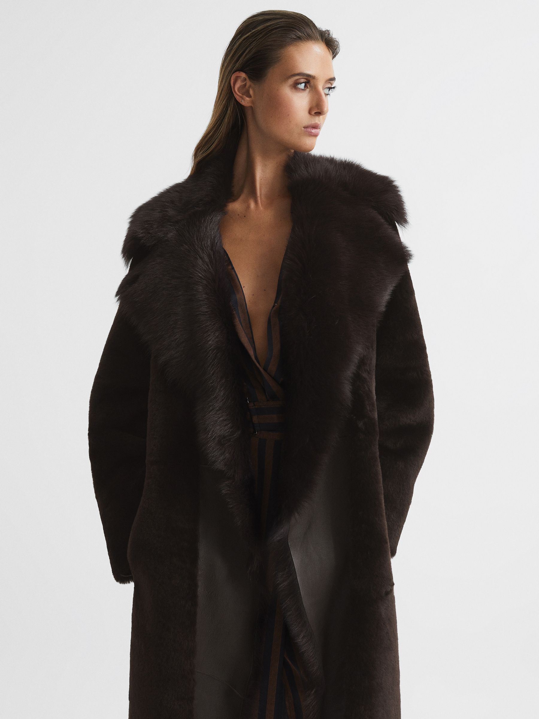 Reversible Longline Shearling Coat in Dark Aubergine