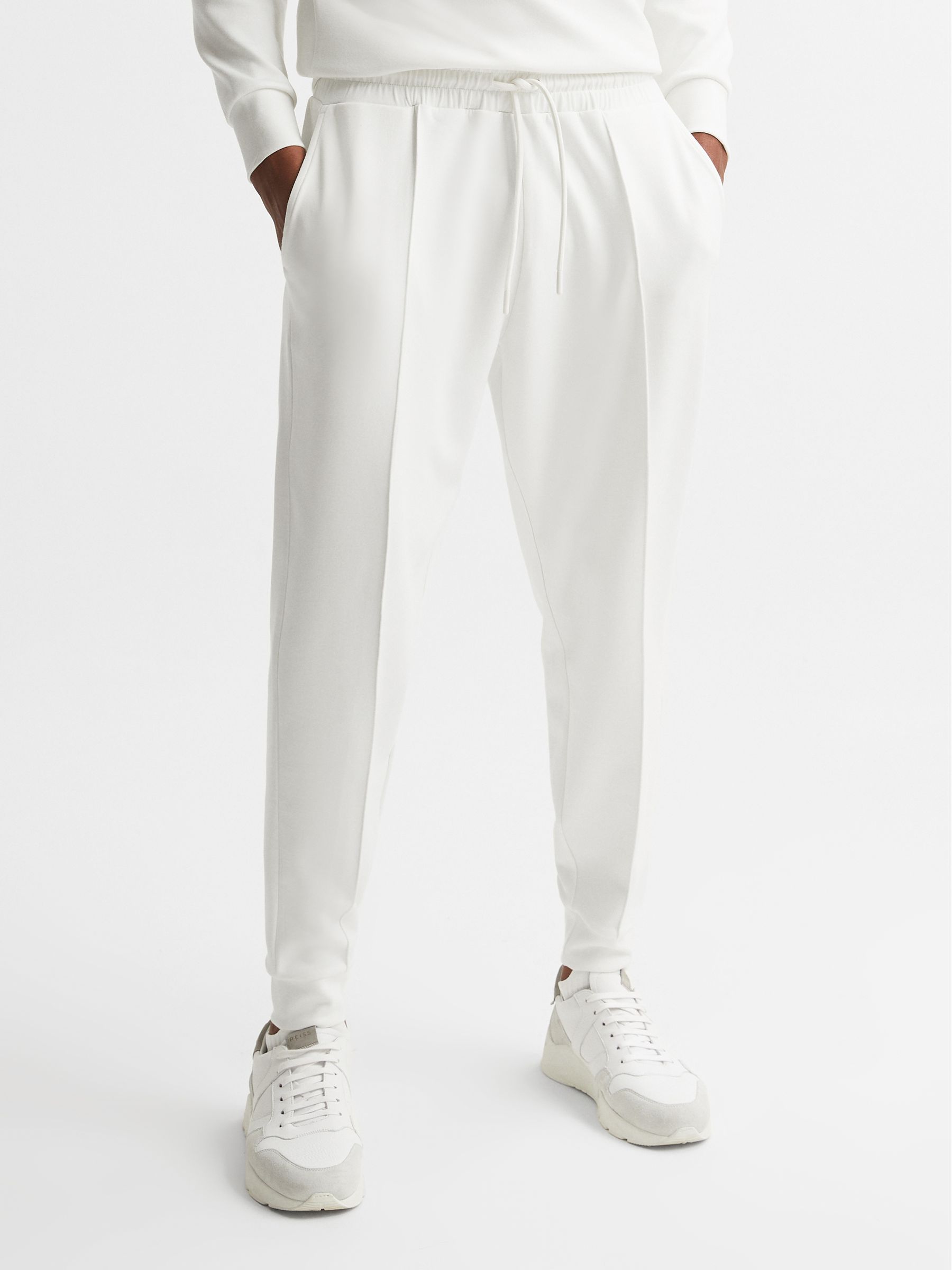 Castore Bonded Joggers in White - Image 1 of 6 Castore Bonded Joggers in White - Image 1 of 6