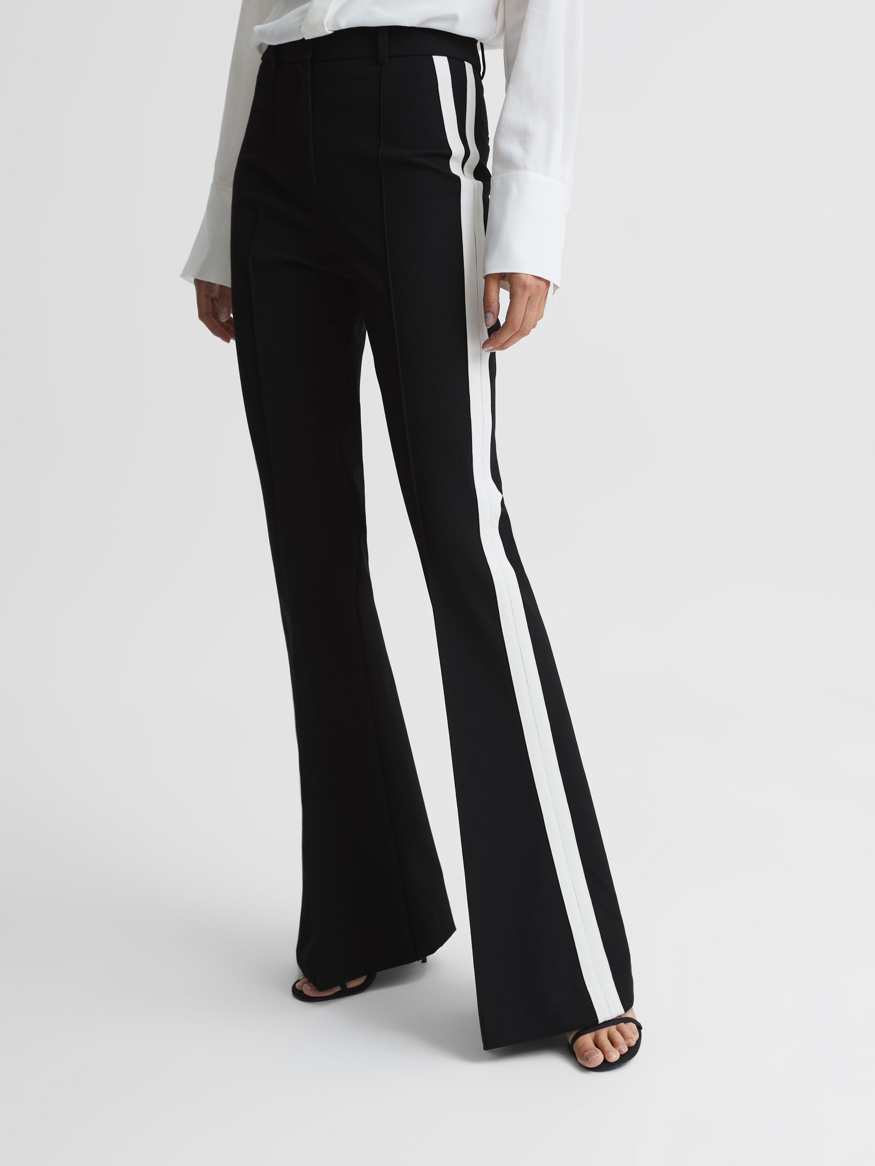 Reiss Flared Side Stripe Trousers in Black | REISS