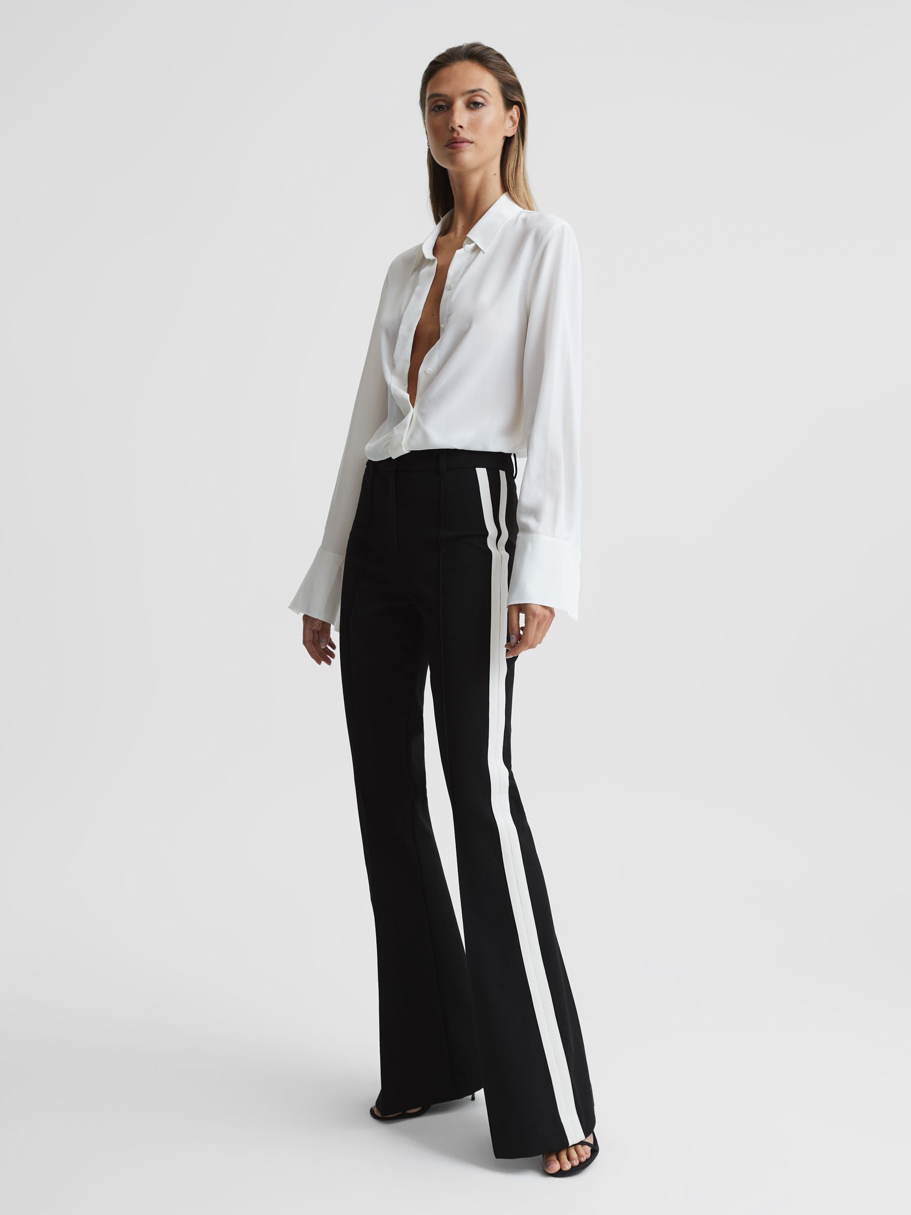 Reiss Flared Side Stripe Trousers in Black | REISS