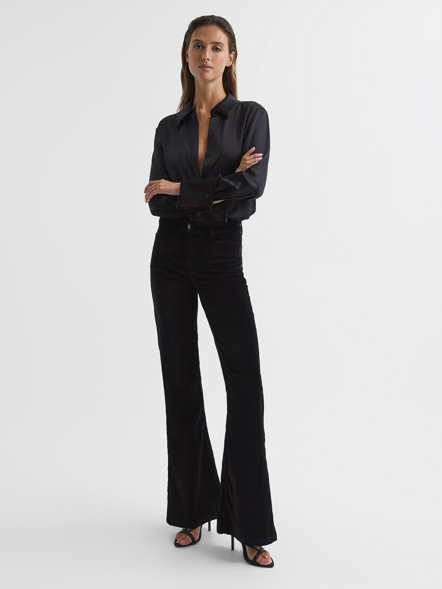 Petite Velvet High Rise Flared Jeans in Black - Image 1 of 7 Petite Velvet High Rise Flared Jeans in Black - Image 1 of 7