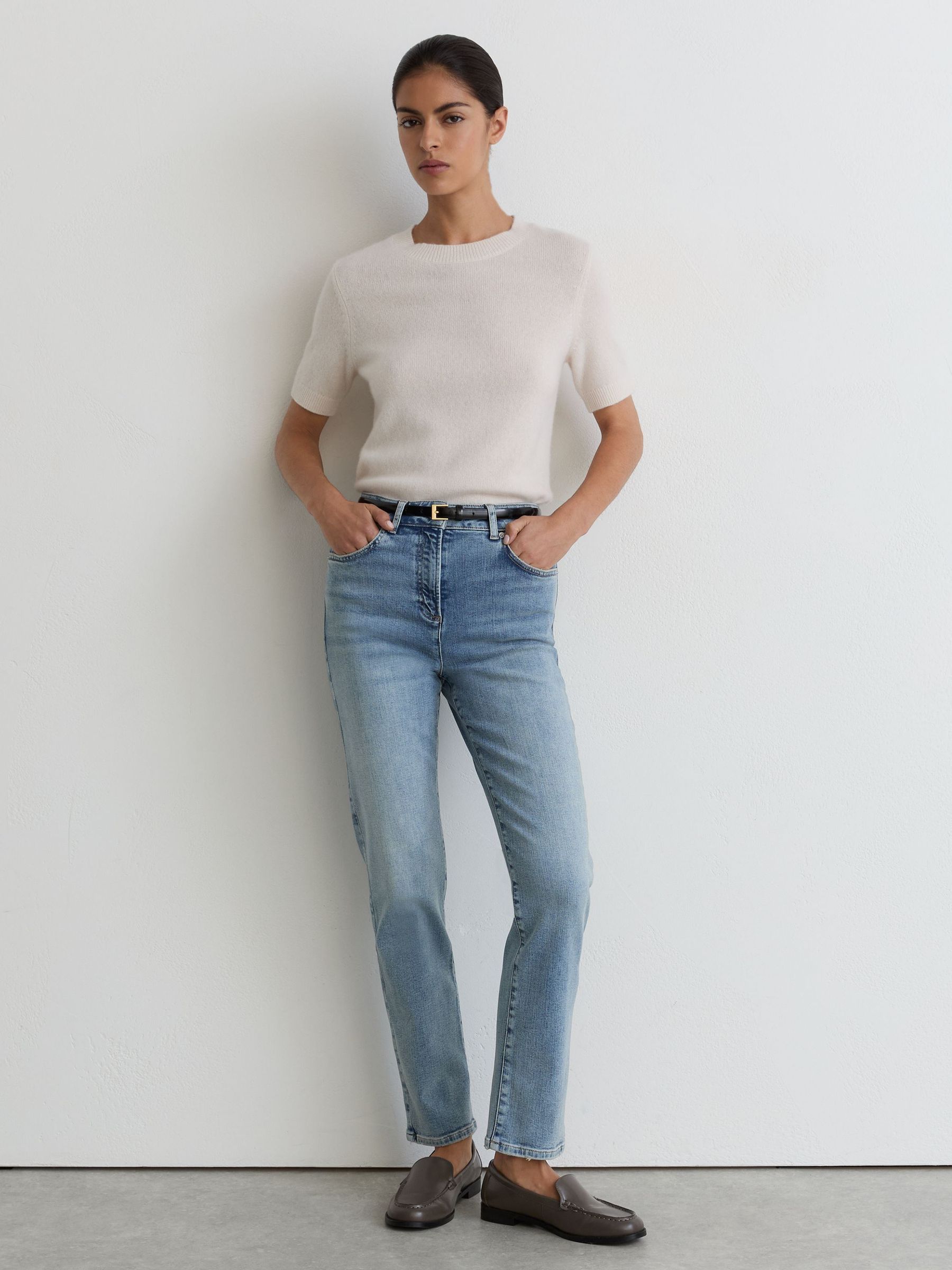Petite Slim-Leg Mid-Rise Jeans in Light Blue - Image 1 of 6 Petite Slim-Leg Mid-Rise Jeans in Light Blue - Image 1 of 6