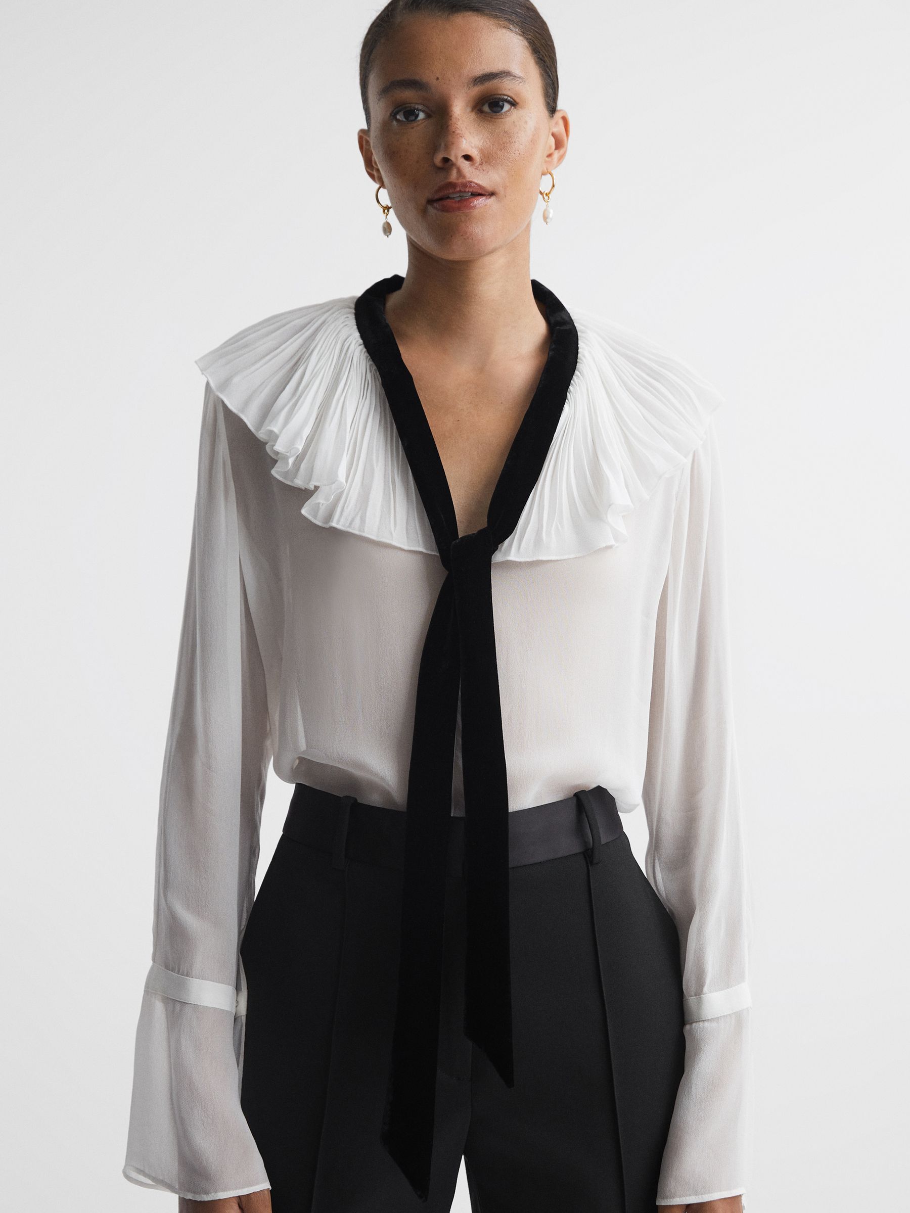 Sheer Ruffle Velvet Tie-Neck Blouse in Cream/Black - Image 1 of 5
