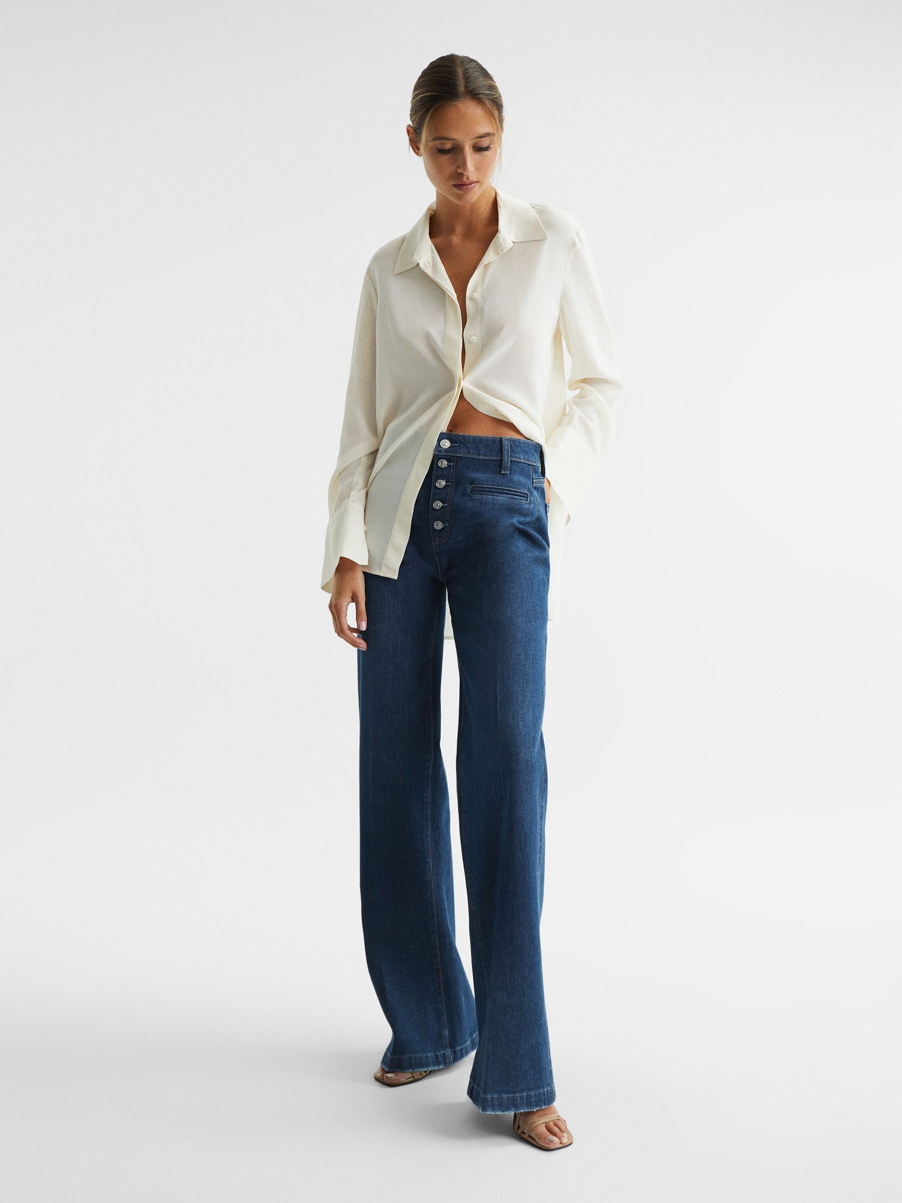 Paige High Rise Flared Jeans in Dark Blue - Image 1 of 12