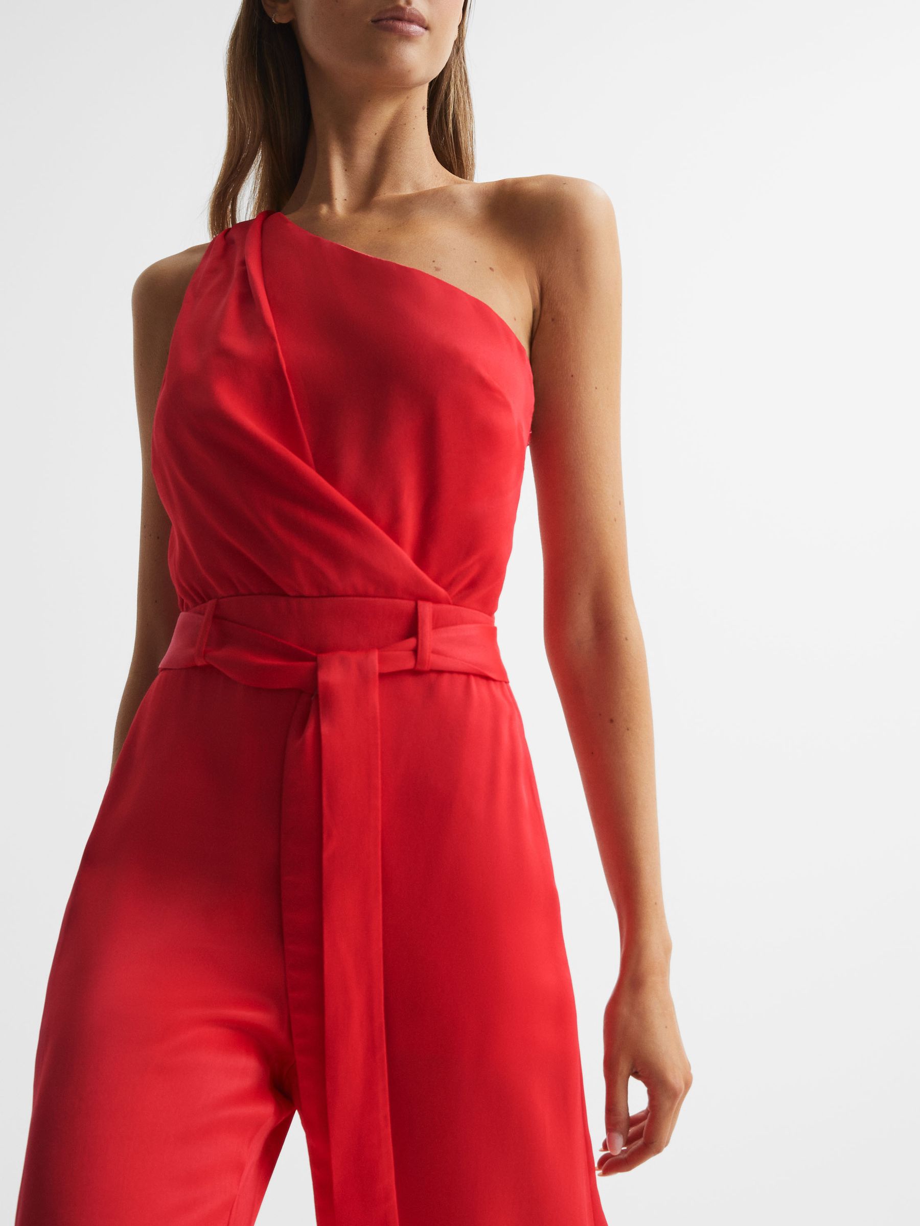 Petite Off-The-Shoulder Jumpsuit in Red - Image 1 of 7 Petite Off-The-Shoulder Jumpsuit in Red - Image 1 of 7