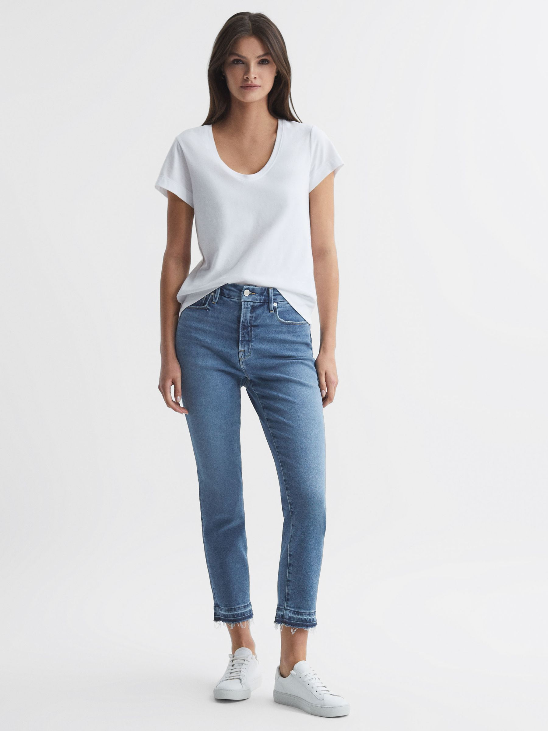 Good American Distressed Cigarette Jeans in Indigo