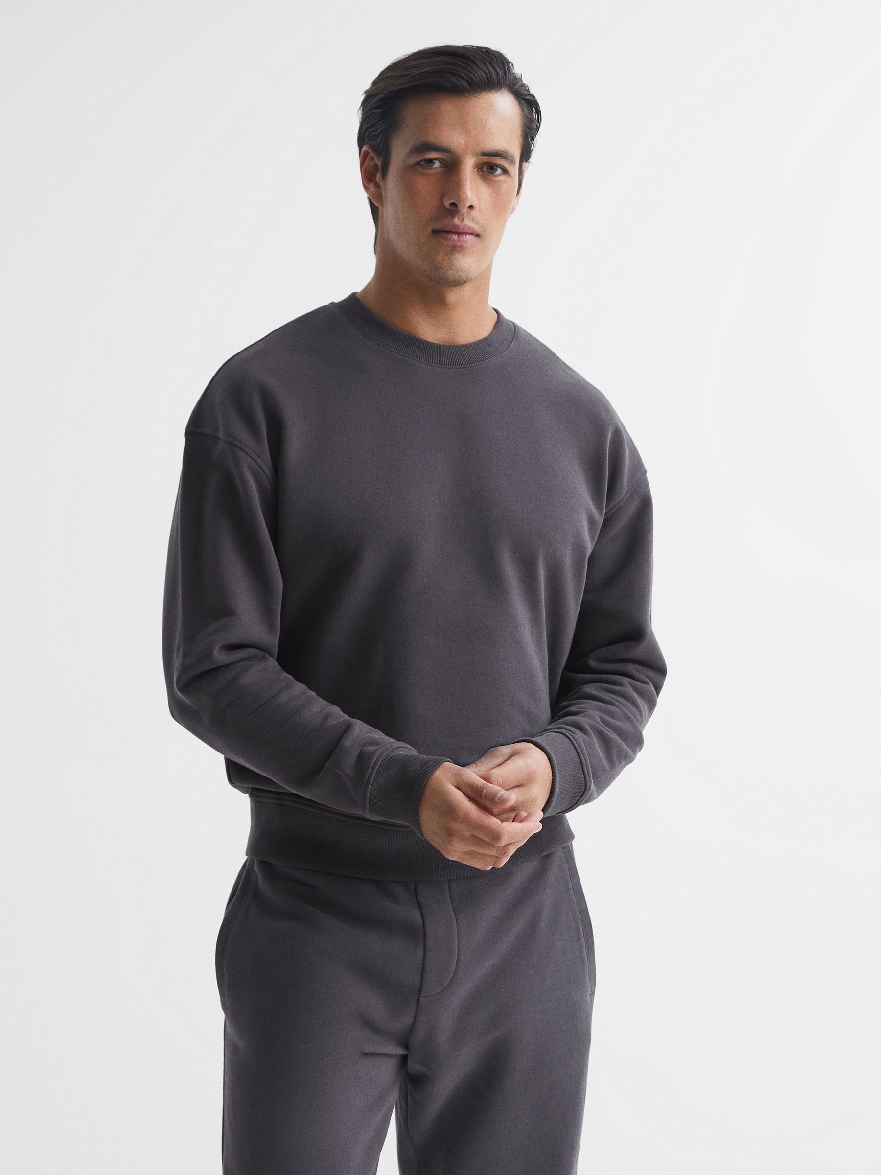 Reiss Oversized Garment Dye Sweatshirt in Washed Black - REISS