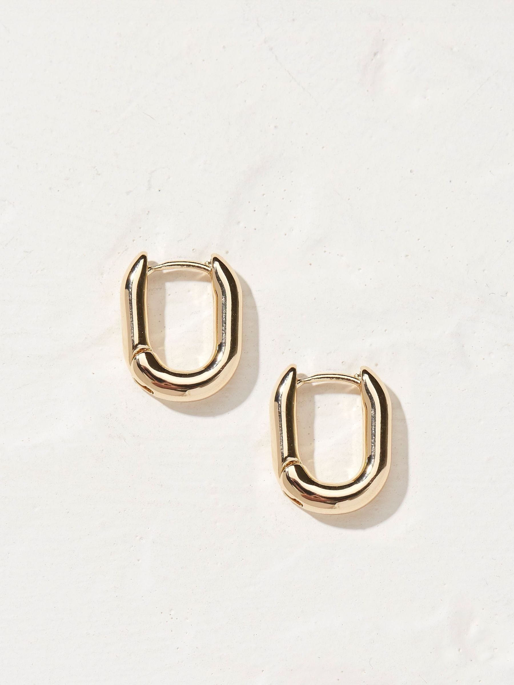 Gold Tone Oval Huggy Hoop Earrings - Image 2 of 3