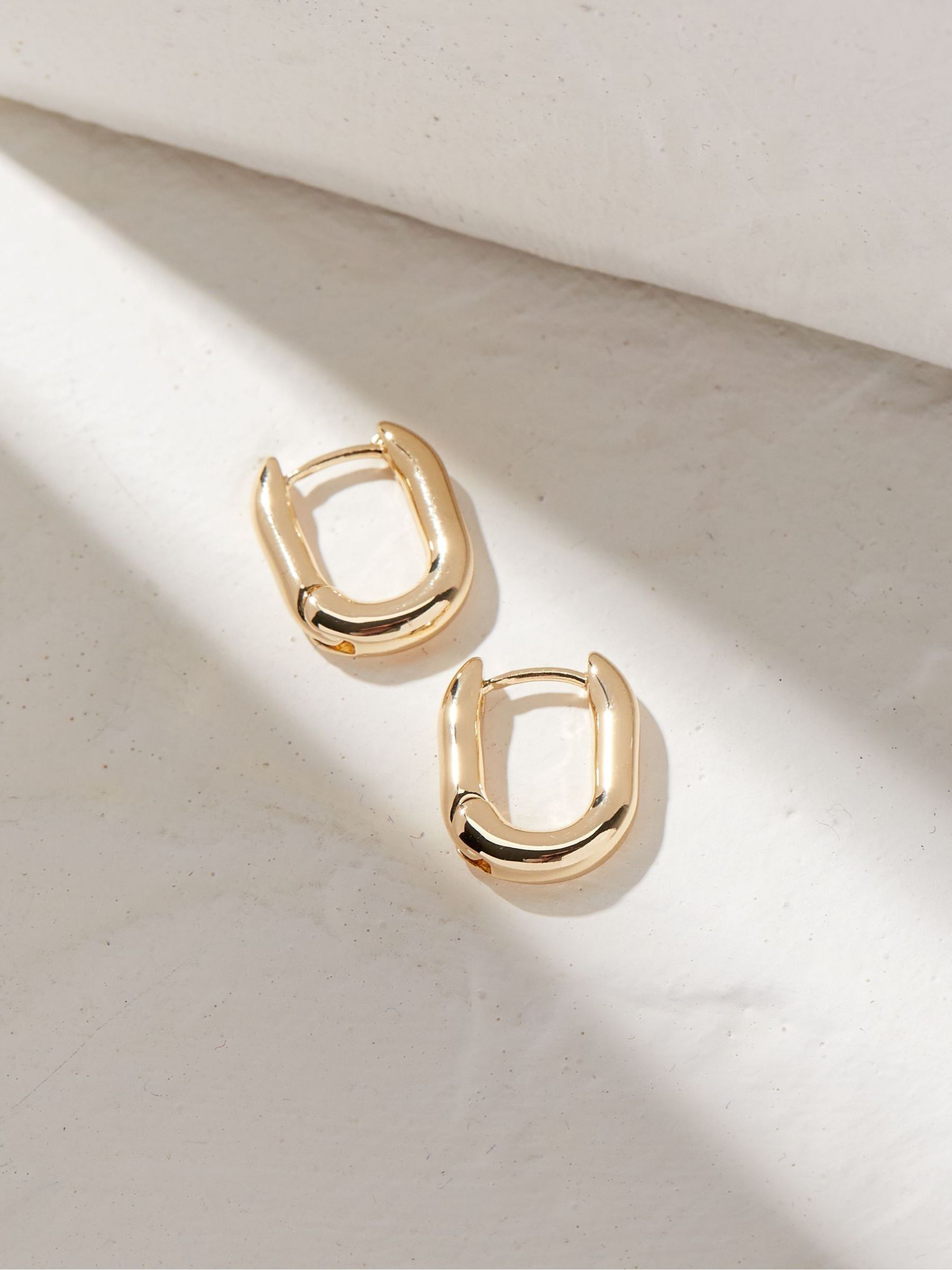 Gold Tone Oval Huggy Hoop Earrings - Image 3 of 3 Gold Tone Oval Huggy Hoop Earrings - Image 3 of 3