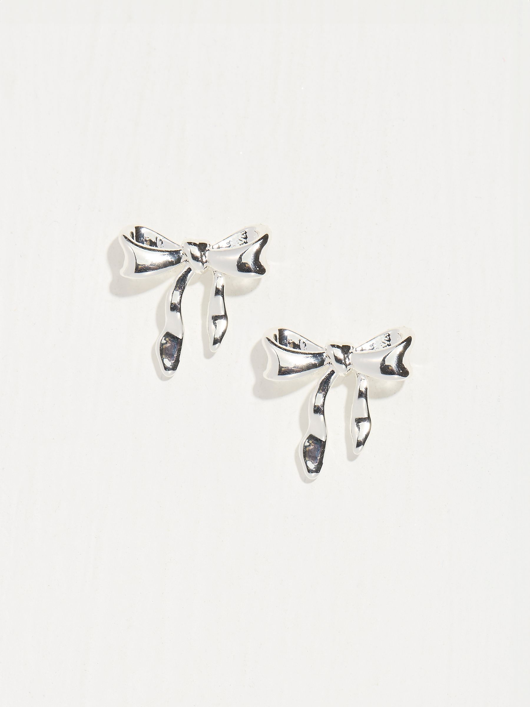 Silver Tone Bow Earrings - Image 1 of 2