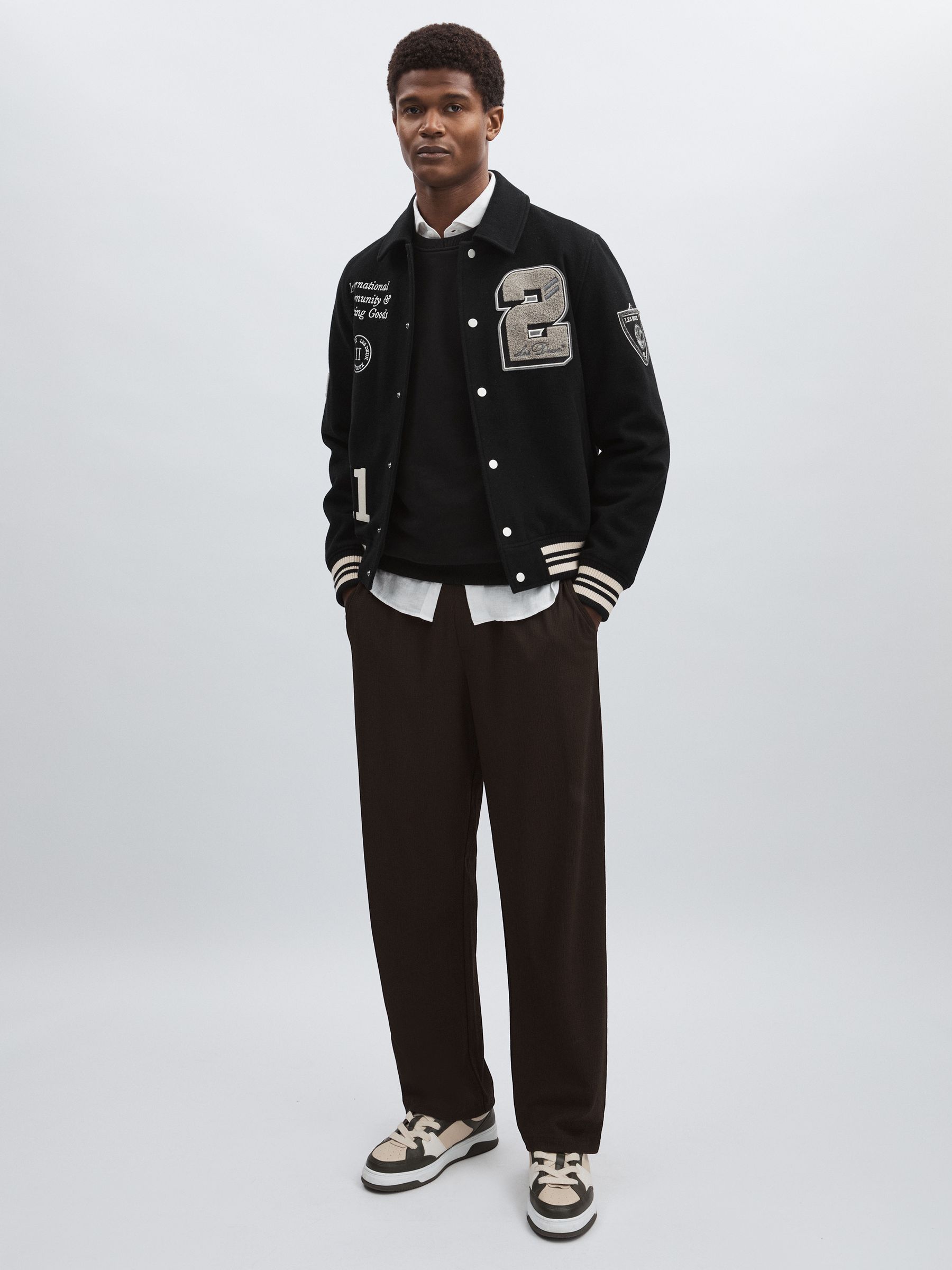 Les Deux Wool-Blend Varsity Jacket in Black - Image 1 of 5 Les Deux Wool-Blend Varsity Jacket in Black - Image 1 of 5
