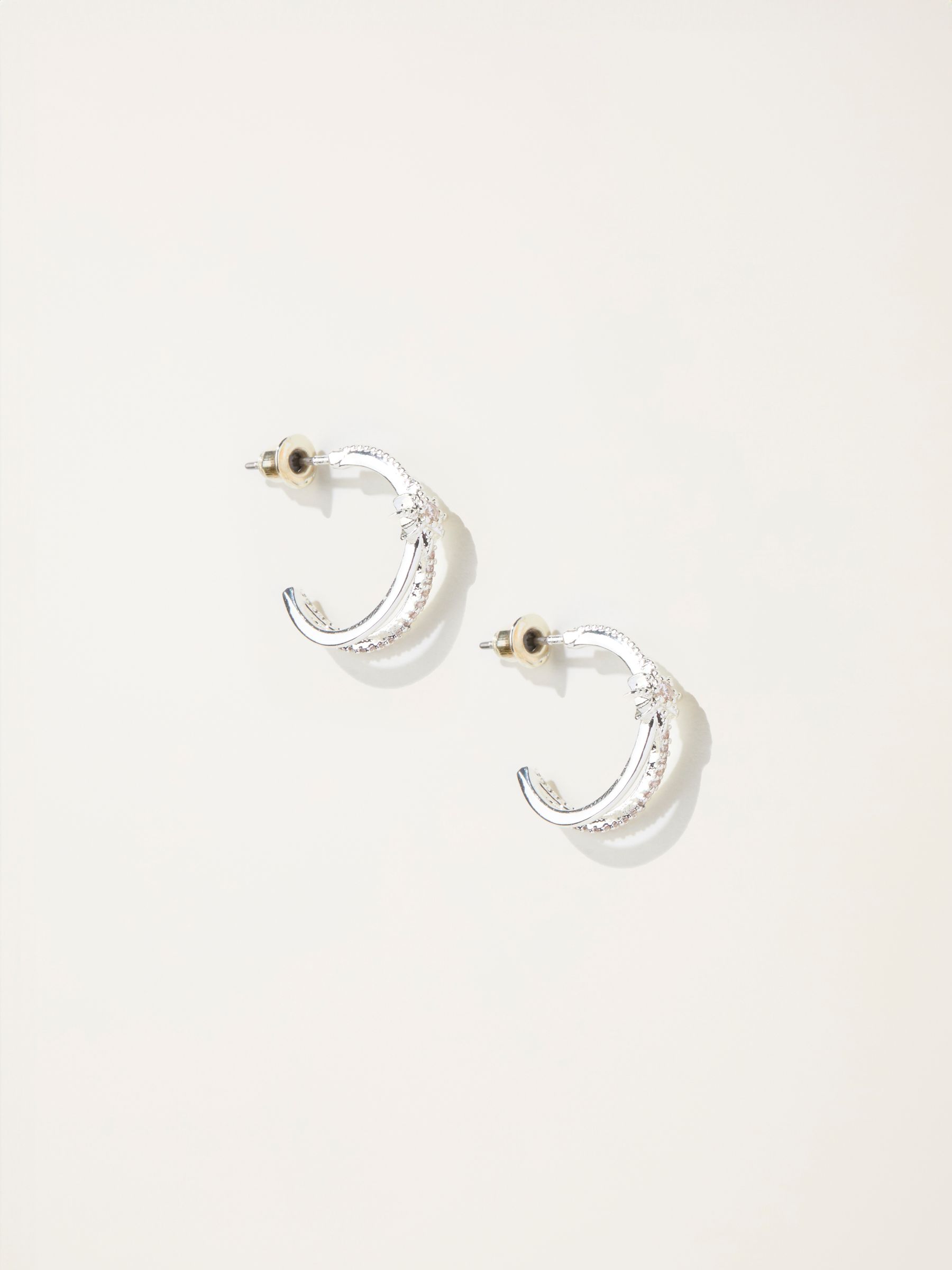 Silver Tone Star Huggie Earrings - Image 1 of 2