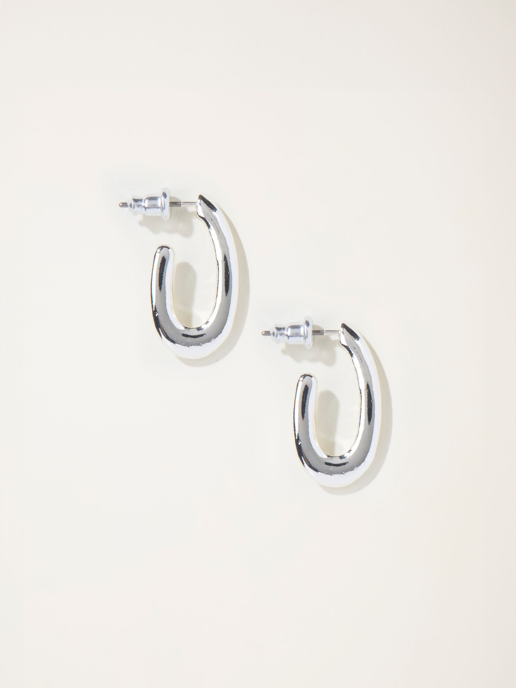 Silver Tone Twist Oval Hoop Earrings - Image 1 of 2