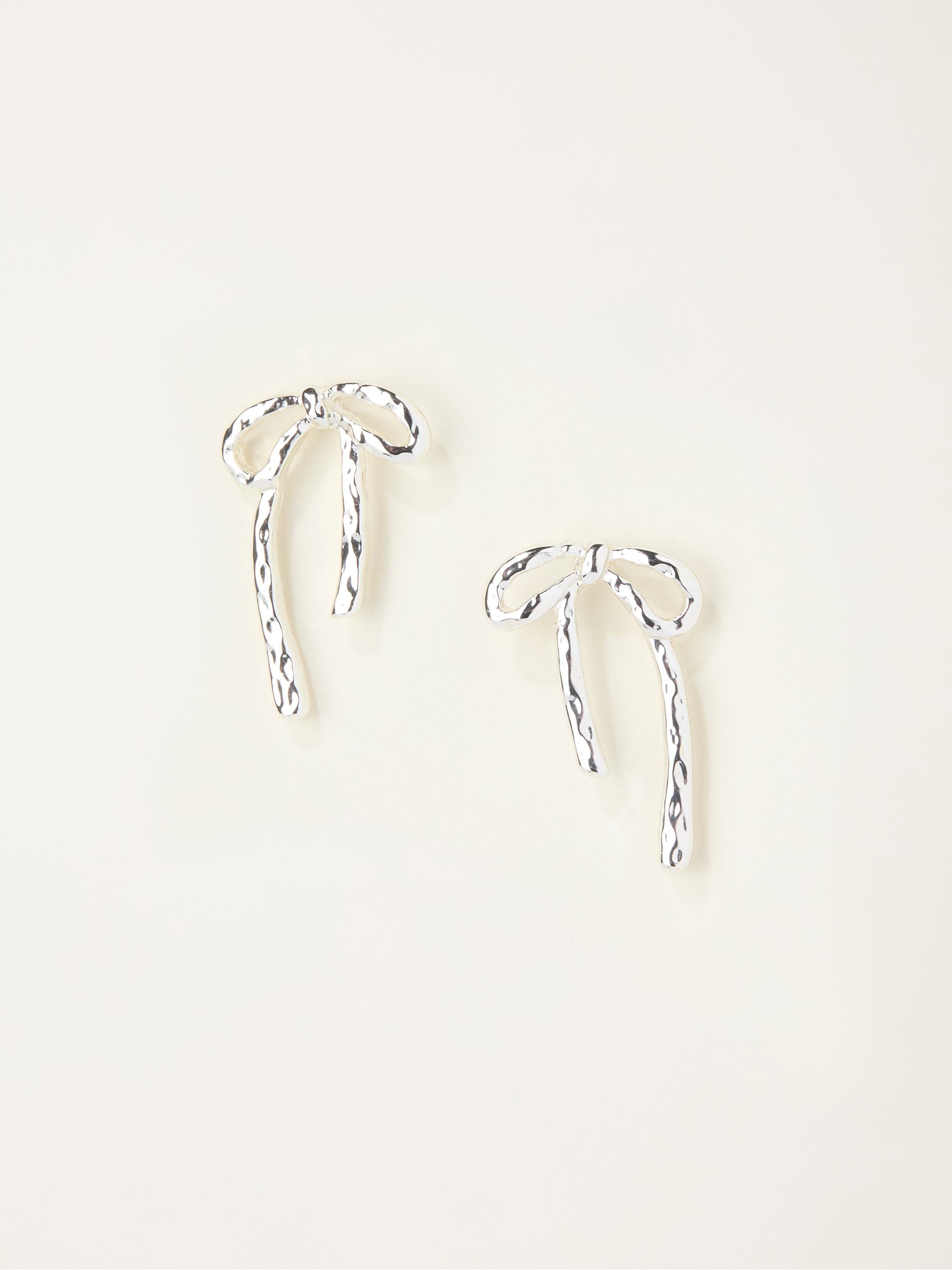 Silver Tone Hammered Bow Earrings - Image 1 of 2