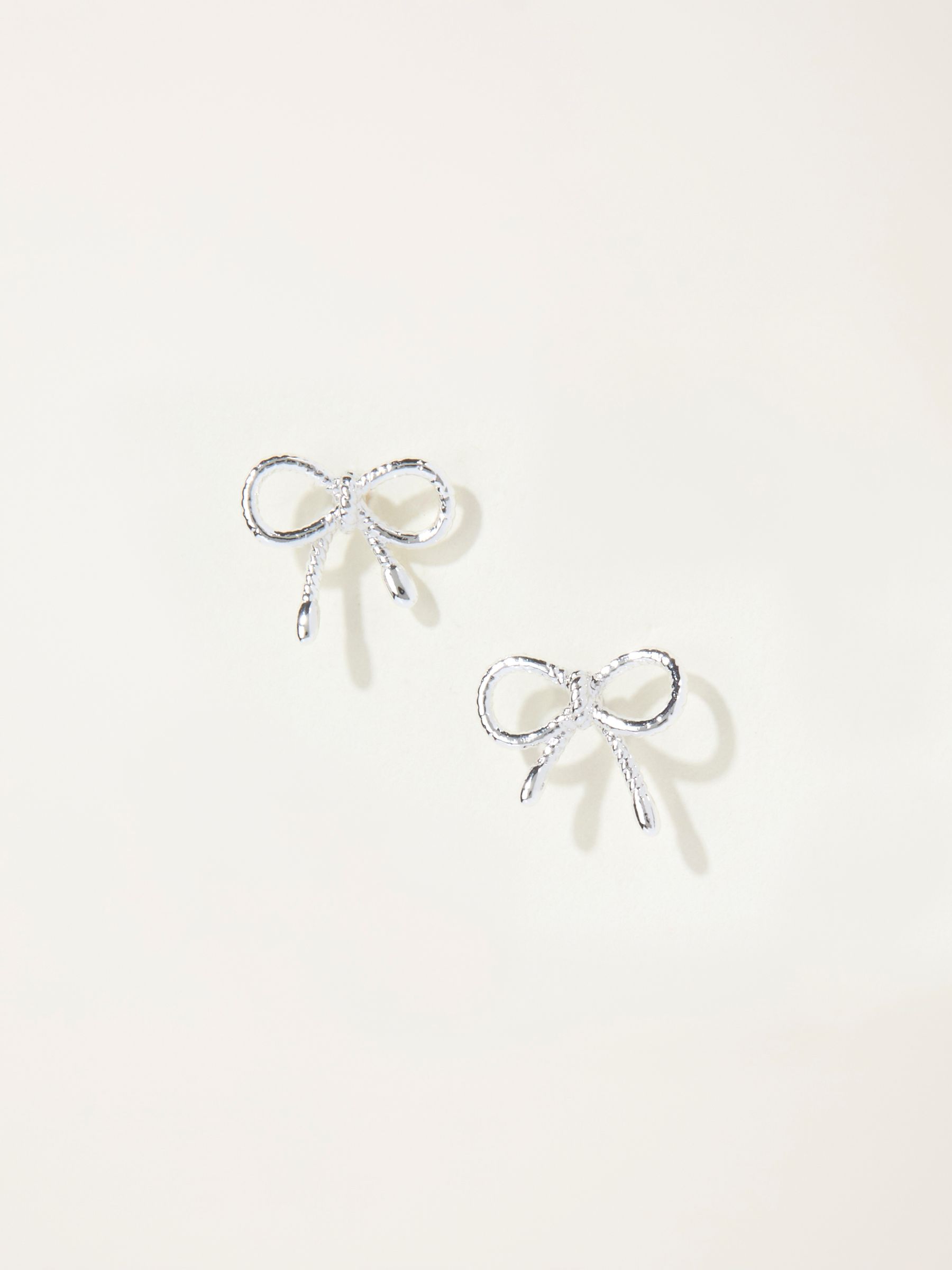 Silver Tone Bow Stud Earrings - Image 1 of 2 Silver Tone Bow Stud Earrings - Image 1 of 2