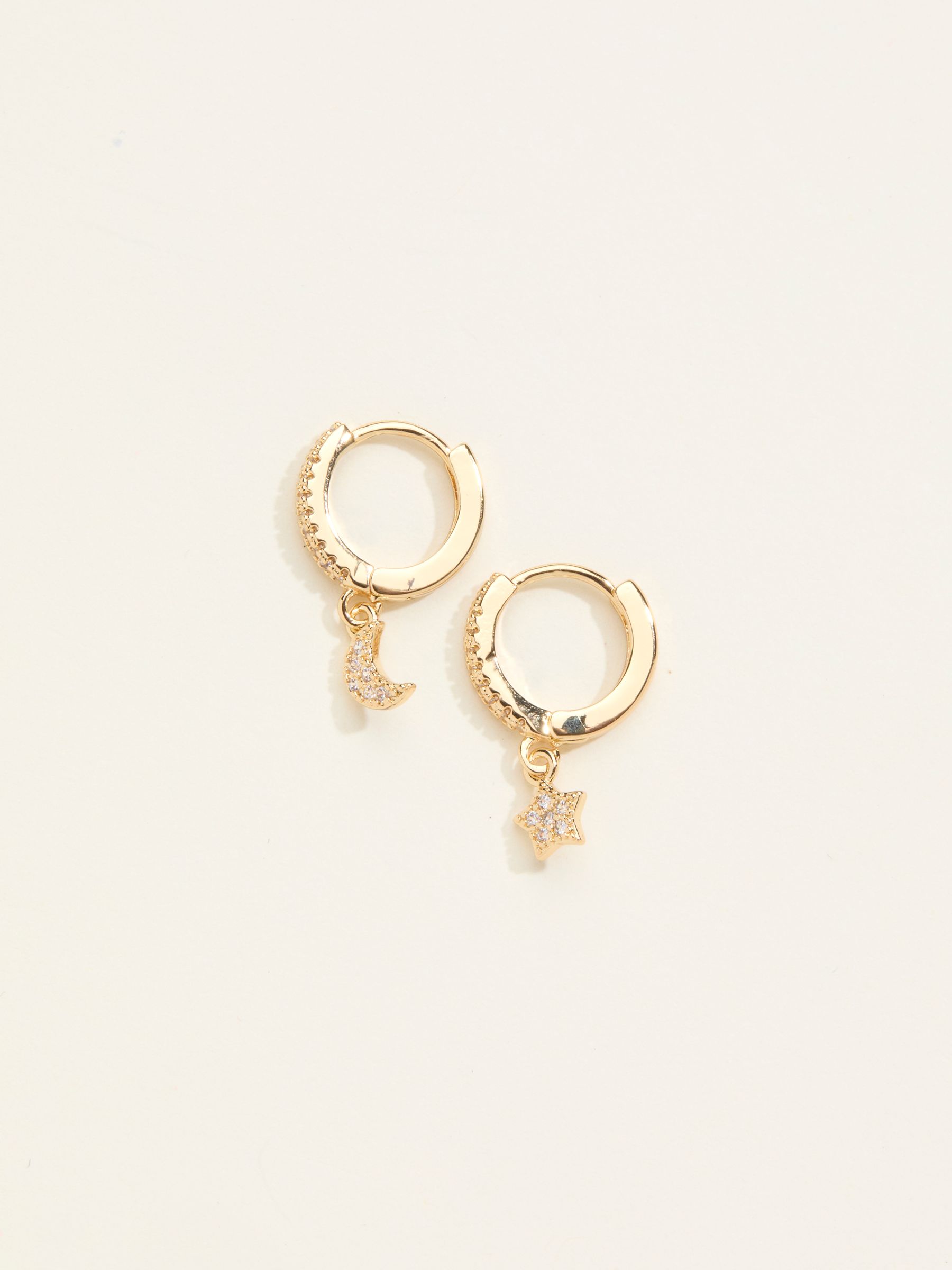 Gold Tone Star and Moon Huggie Earrings - Image 1 of 2