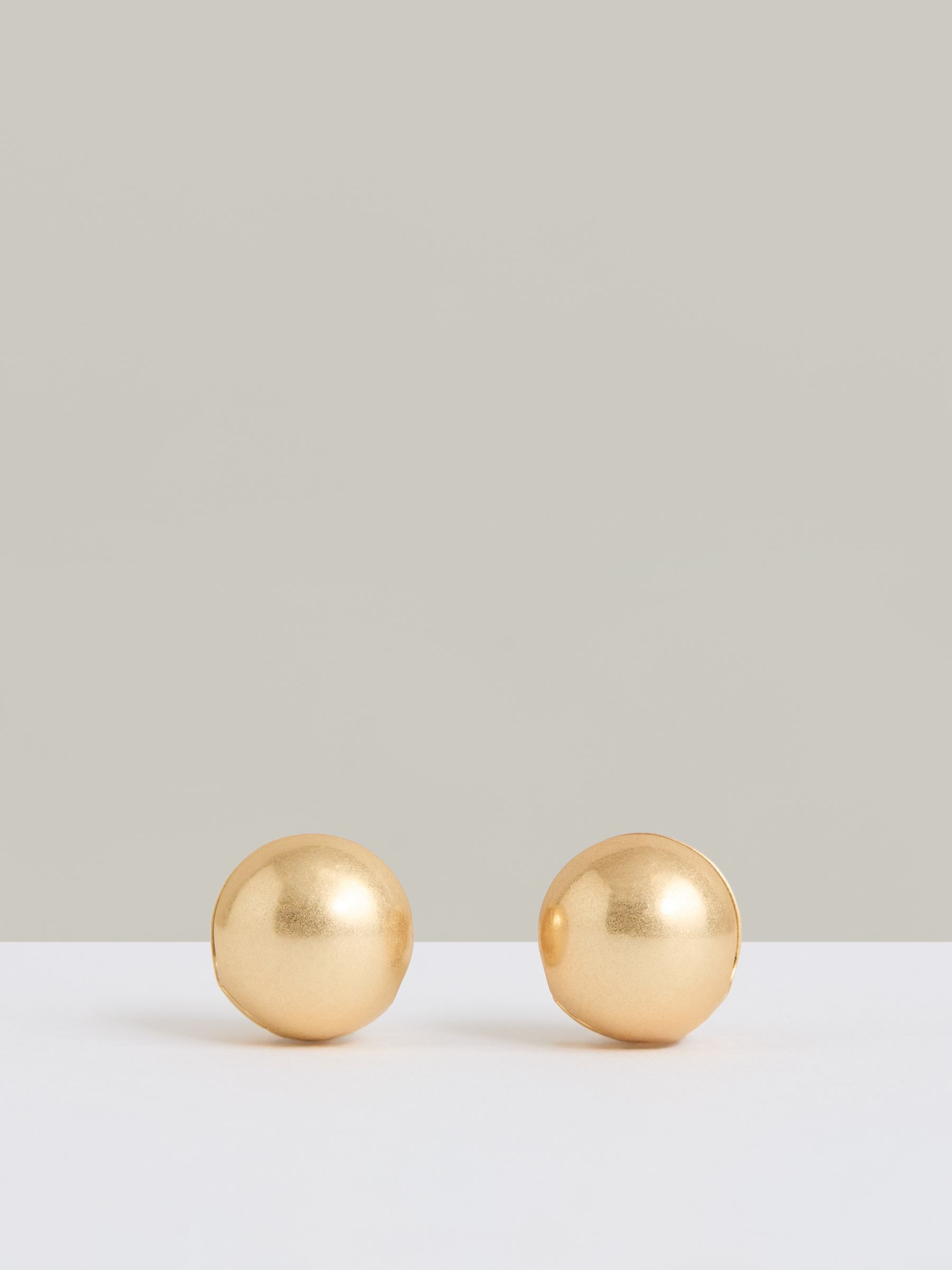 Polished Ball Huggie Earrings in Gold - Image 1 of 4