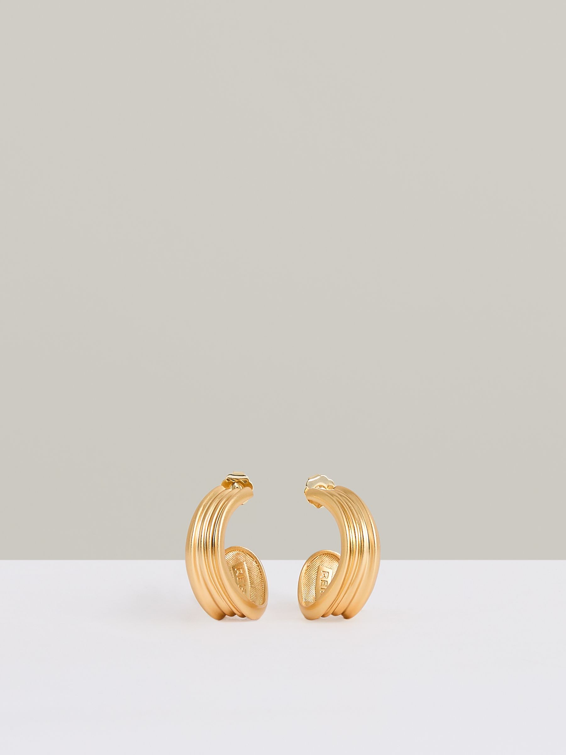 Fluid Hoop Earrings in Gold Tone - Image 1 of 4