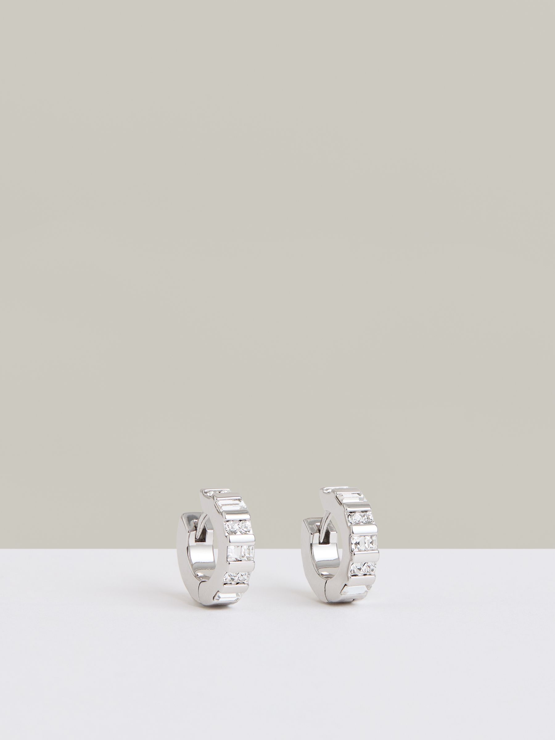 Crystal Huggie Earrings in Silver Tone - Image 1 of 4