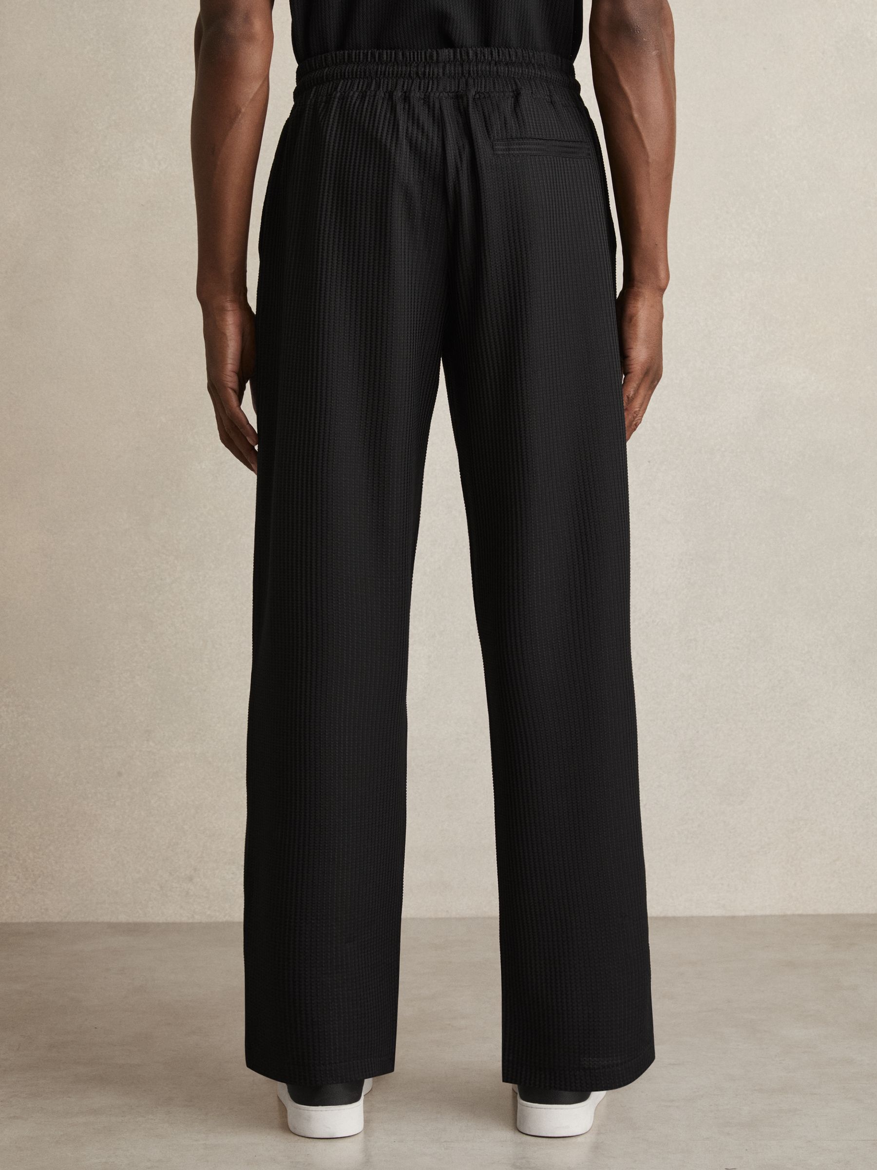 Textured-Knit Tapered Trousers in Black - Image 5 of 6