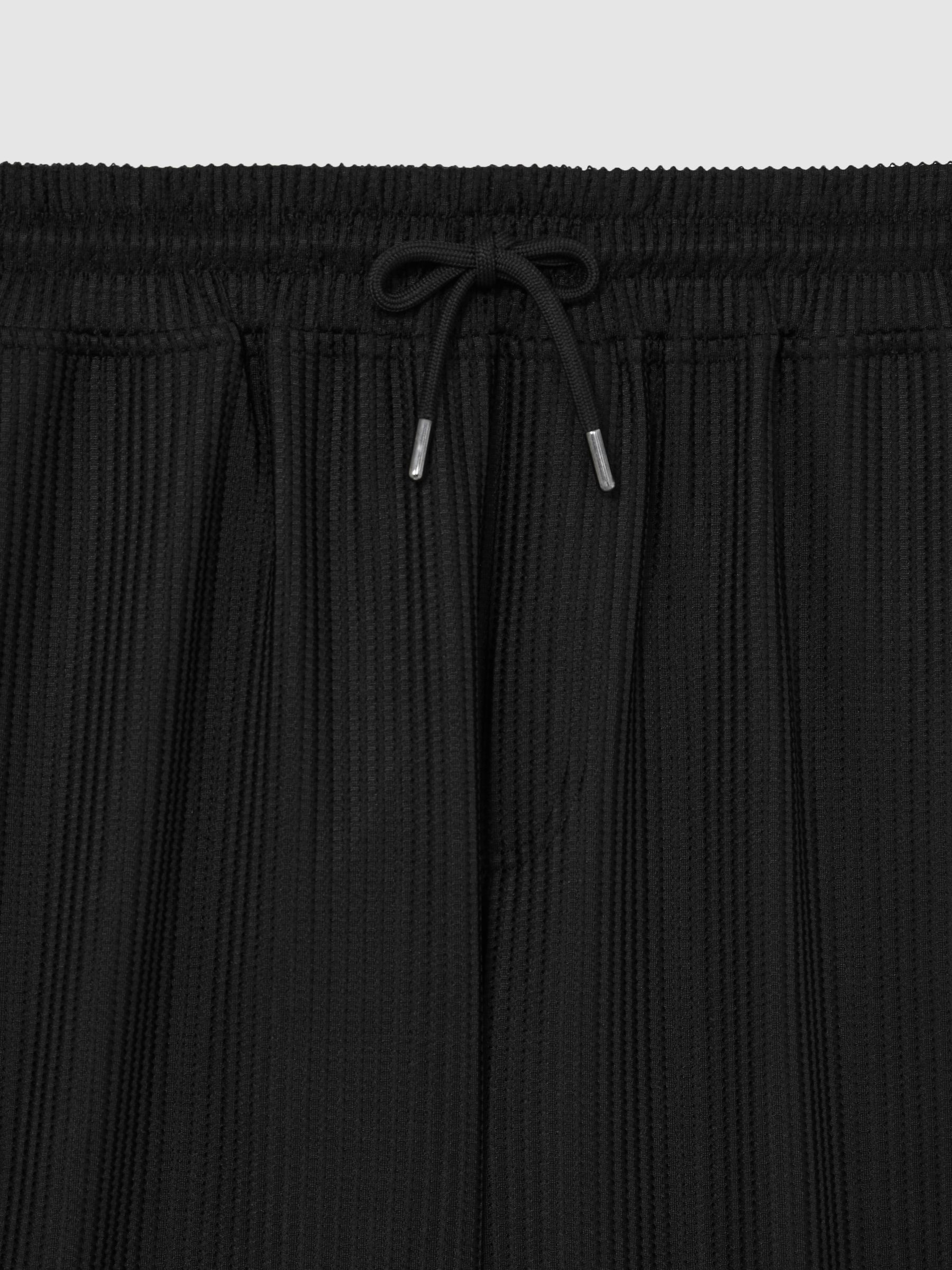 Textured-Knit Tapered Trousers in Black - Image 6 of 6