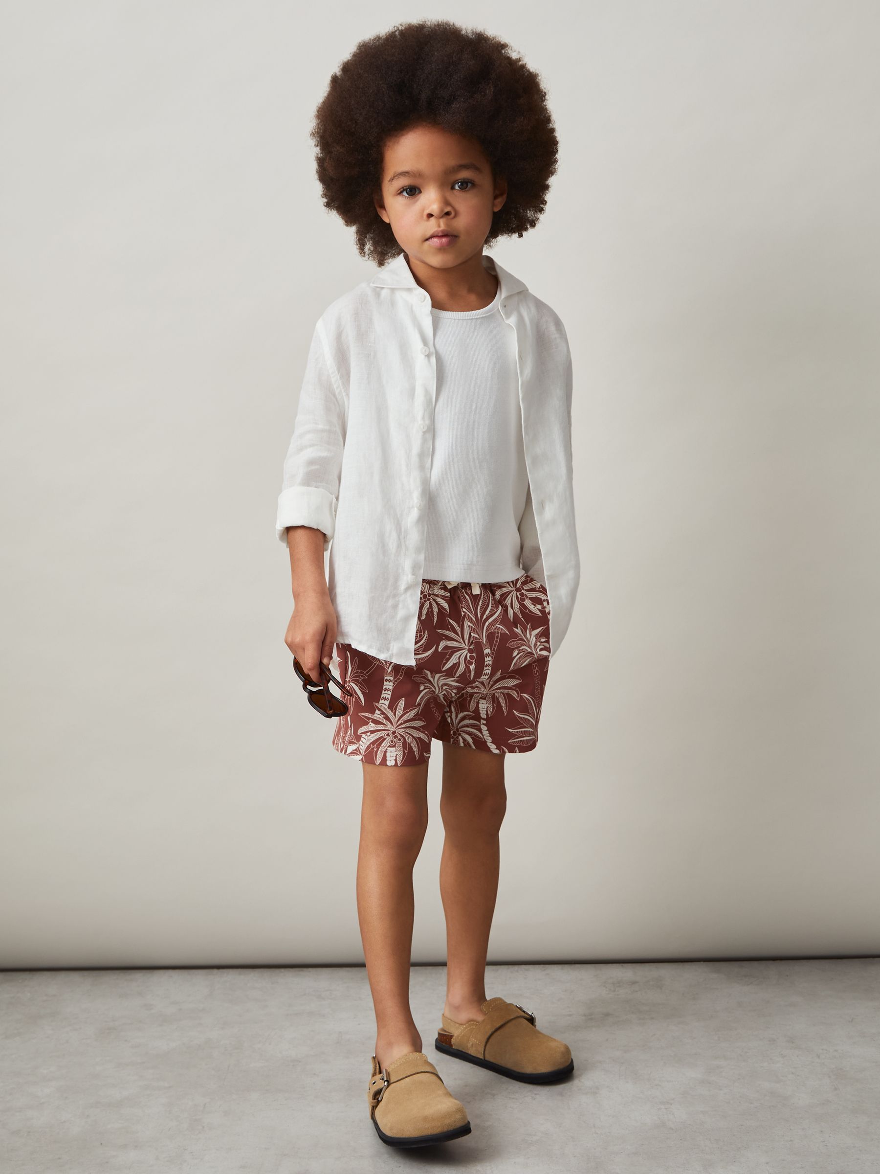 3-9 yrs Palm-Print Swim Shorts in Rust/Off White - Image 1 of 4 3-9 yrs Palm-Print Swim Shorts in Rust/Off White - Image 1 of 4