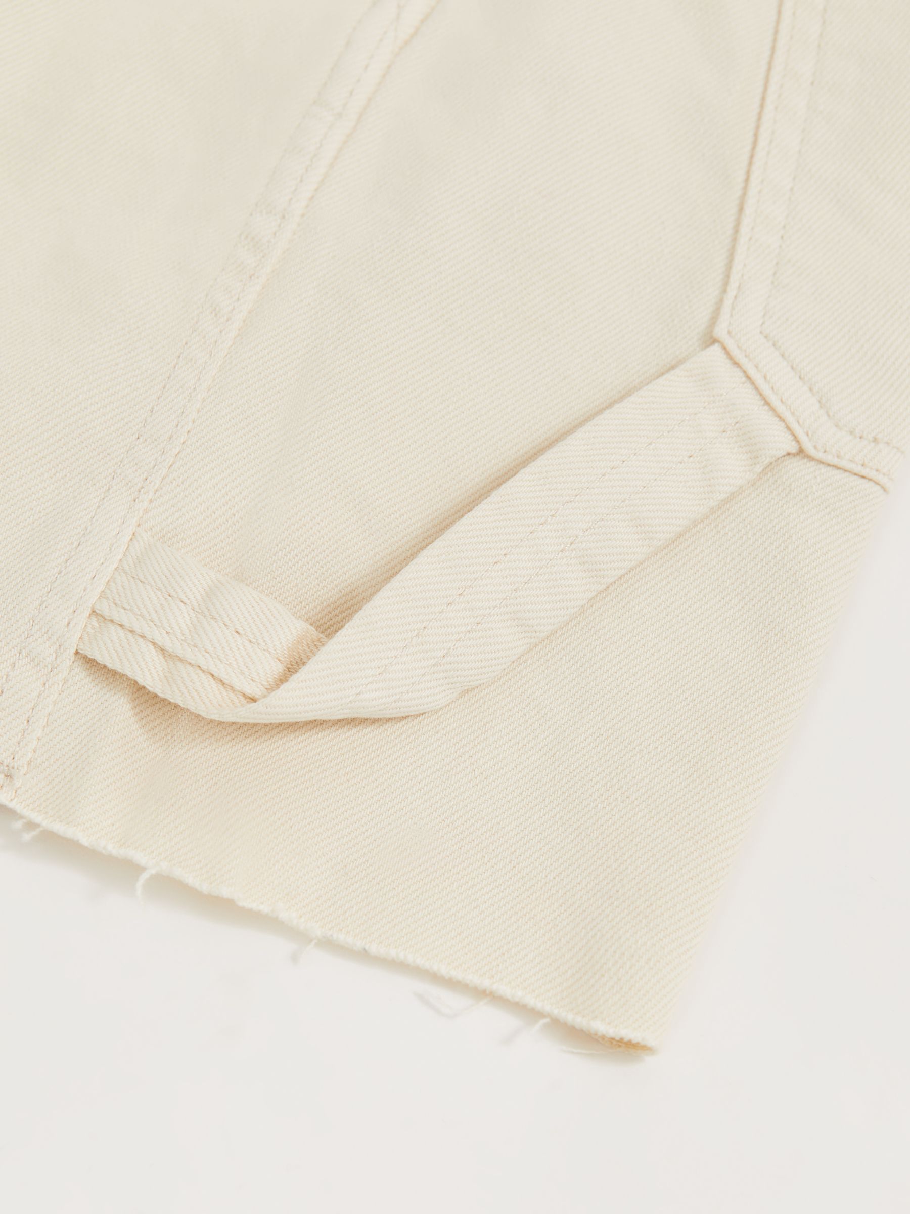 Good American Long Denim Shorts in Ecru - image 5