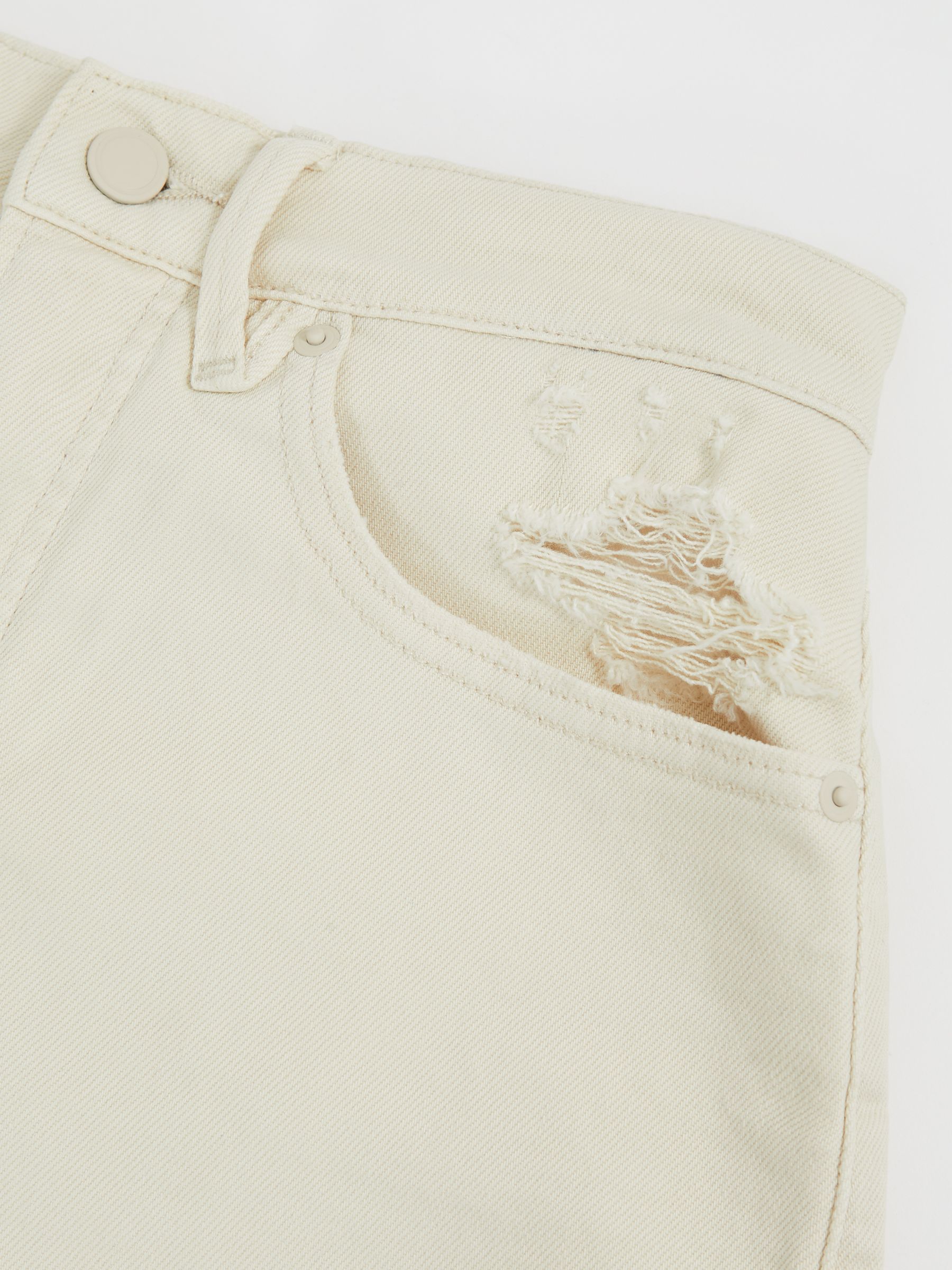 Good American Distressed Denim Shorts in Ecru - image 5