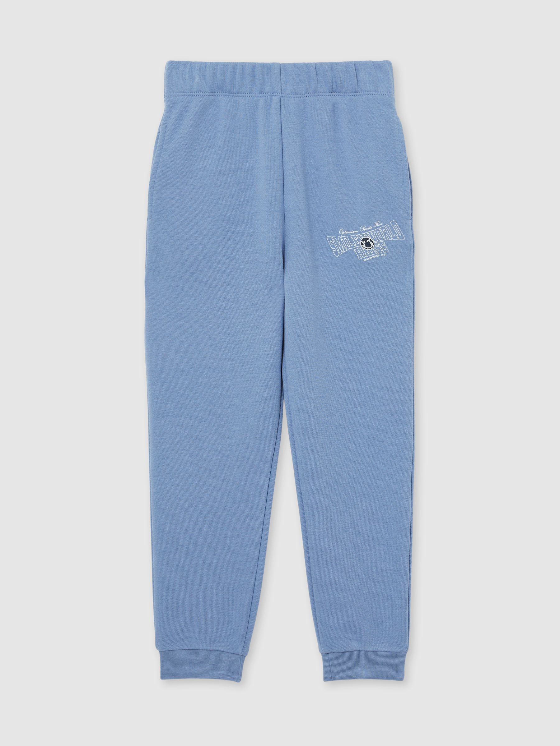 13-14 yrs SmileyWorld | Reiss Cuffed Joggers Unisex Fit in Blue - Image 1 of 6 13-14 yrs SmileyWorld | Reiss Cuffed Joggers Unisex Fit in Blue - Image 1 of 6