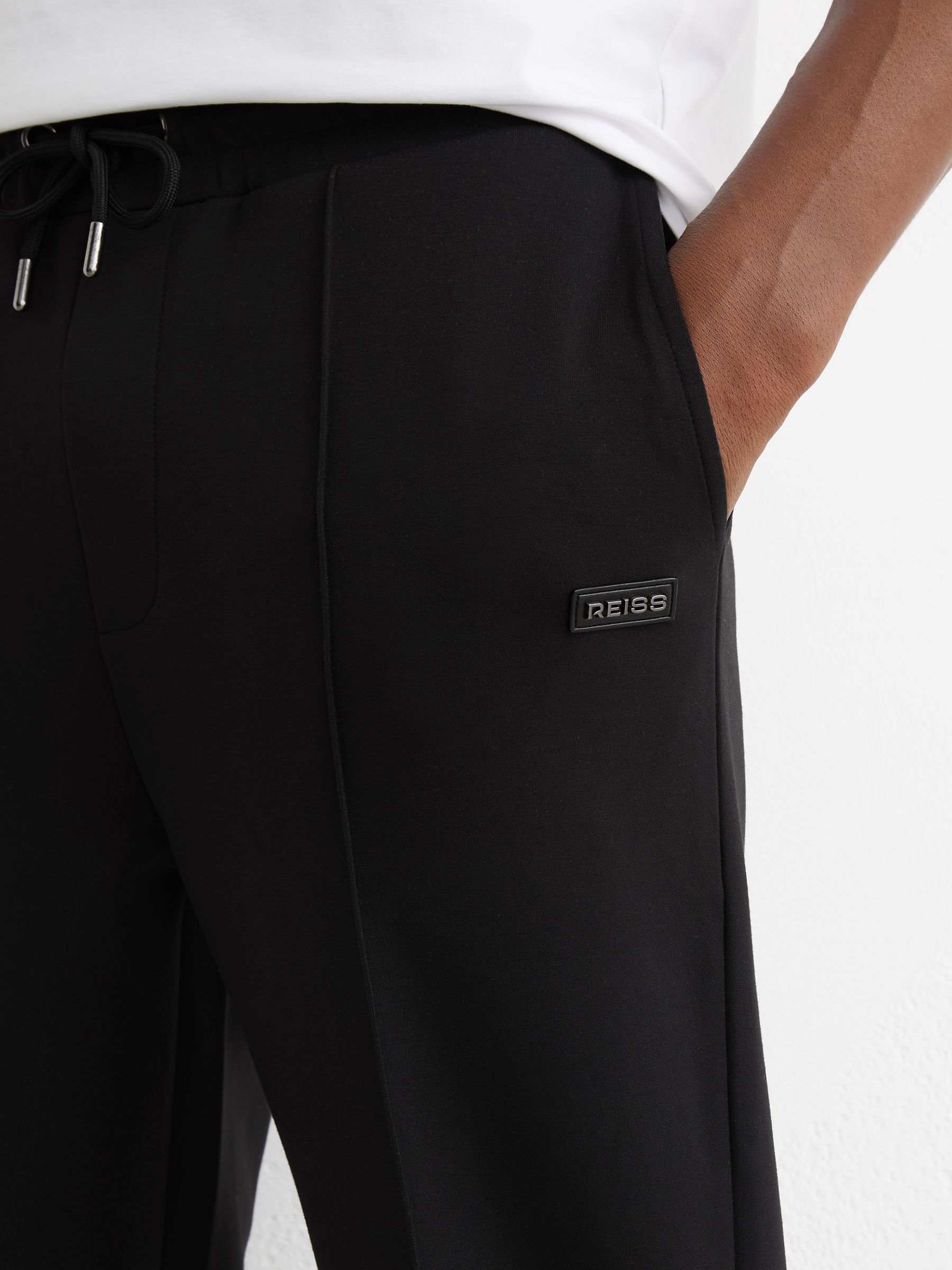 Premium Interlock Cuffed Logo Joggers in Black - image 5