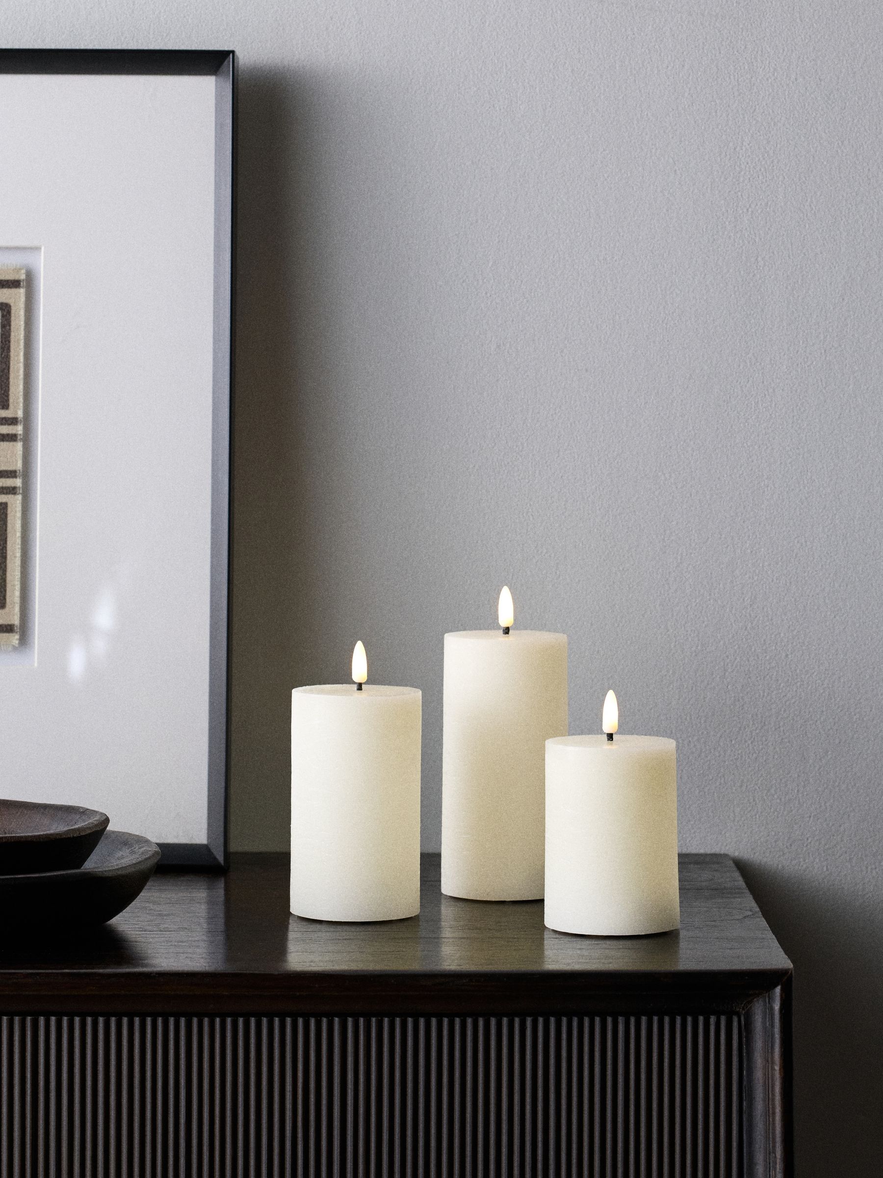 The Set 12 Pack Cream Real Wax LED Candles - Image 1 of 5