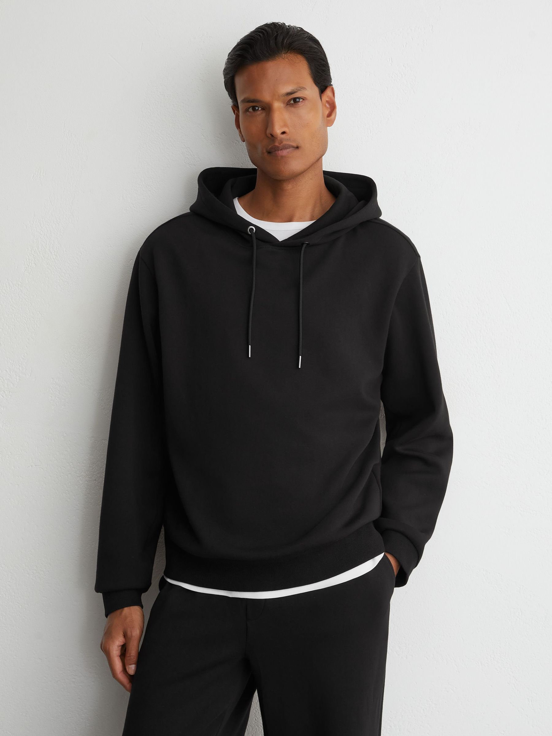 Premium Interlock Relaxed-Fit Hoodie in Black - Obrázek 1 z 7