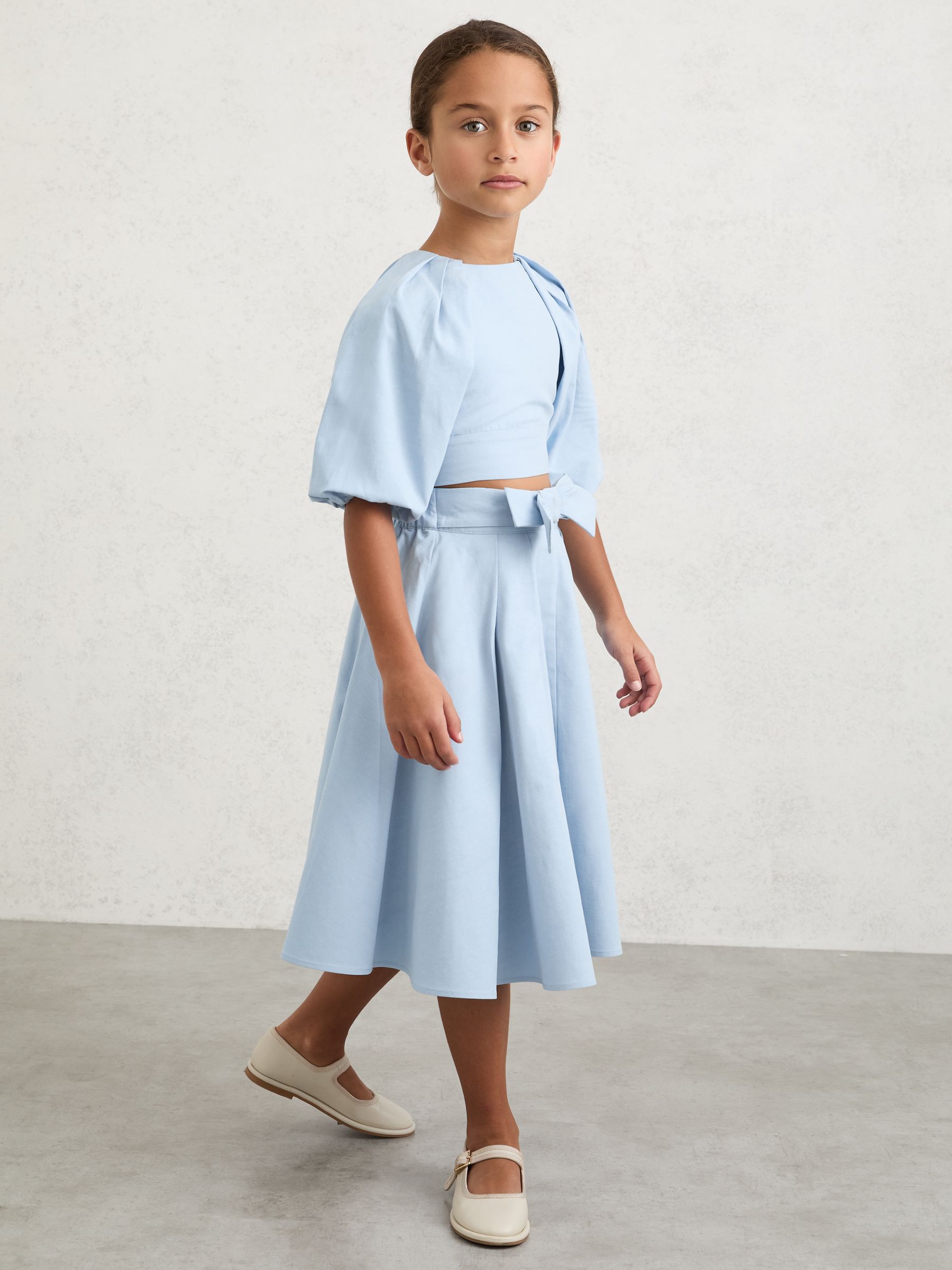 Bow-Detail Pleated Midi Skirt in Pale Blue - Image 1 of 6 Bow-Detail Pleated Midi Skirt in Pale Blue - Image 1 of 6