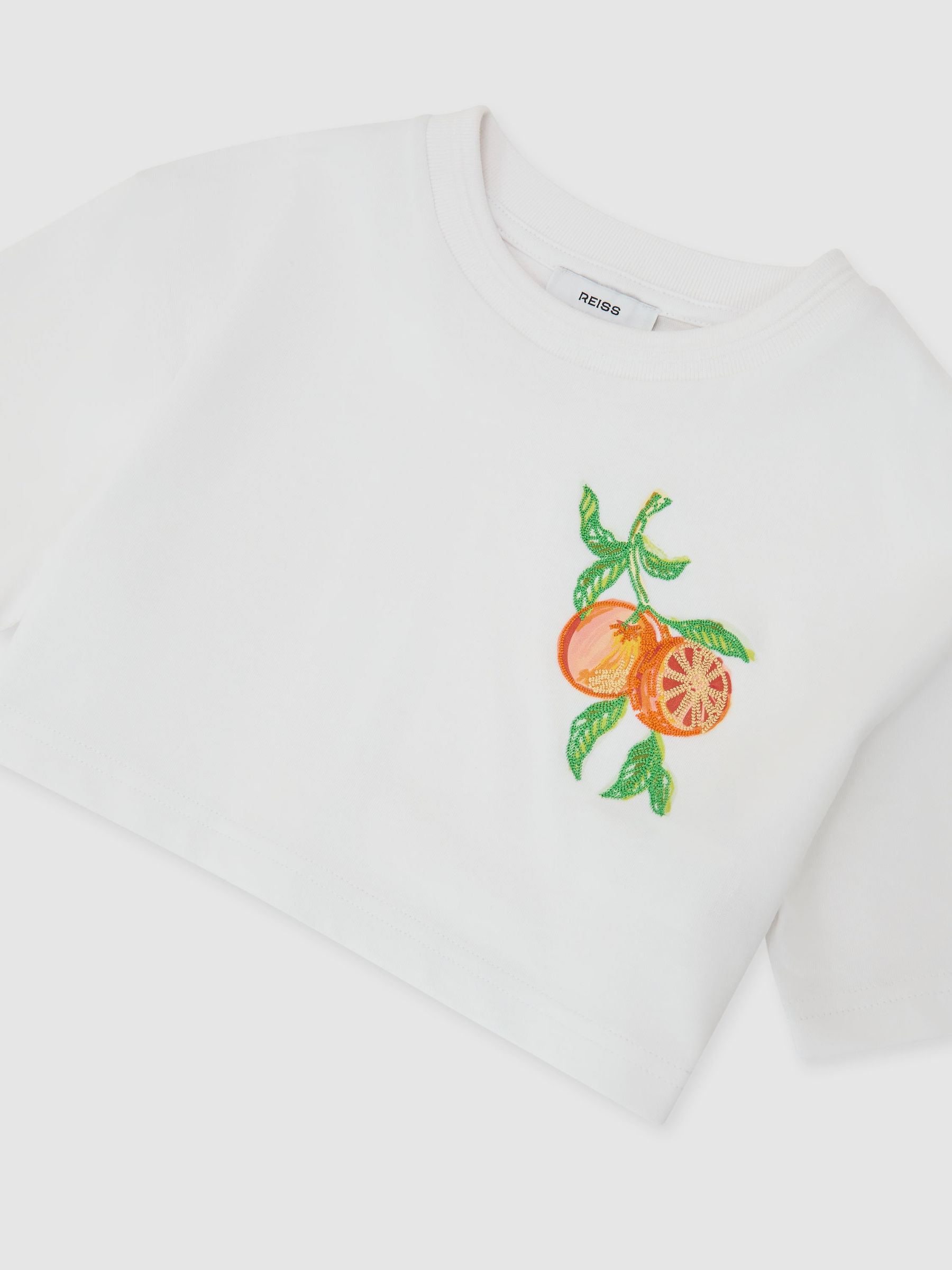 Cotton Embroidered Cropped T-Shirt in White - Image 1 of 3