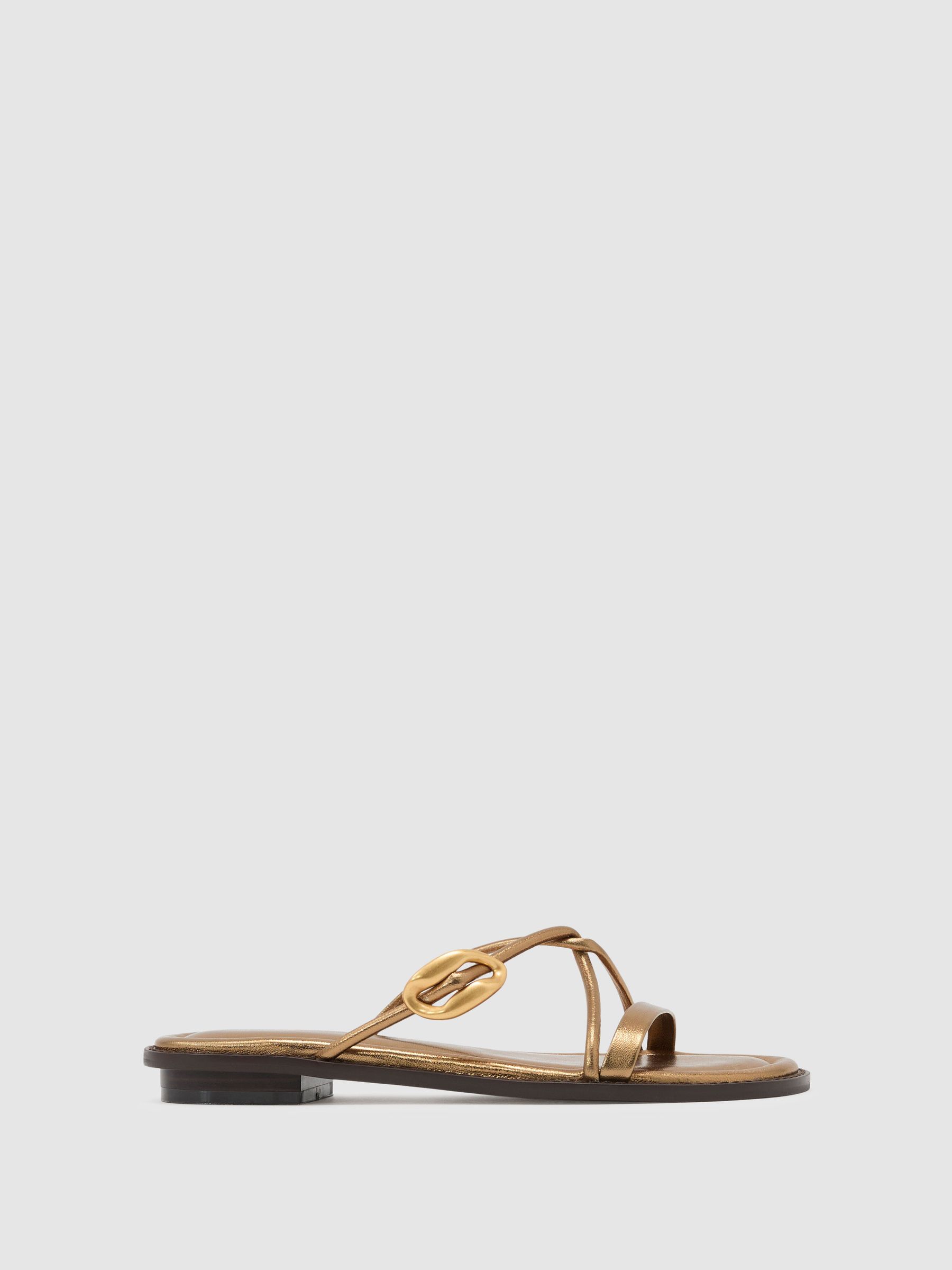 Leather Twist-Strap Flat Sandals in Dark Gold - image 1