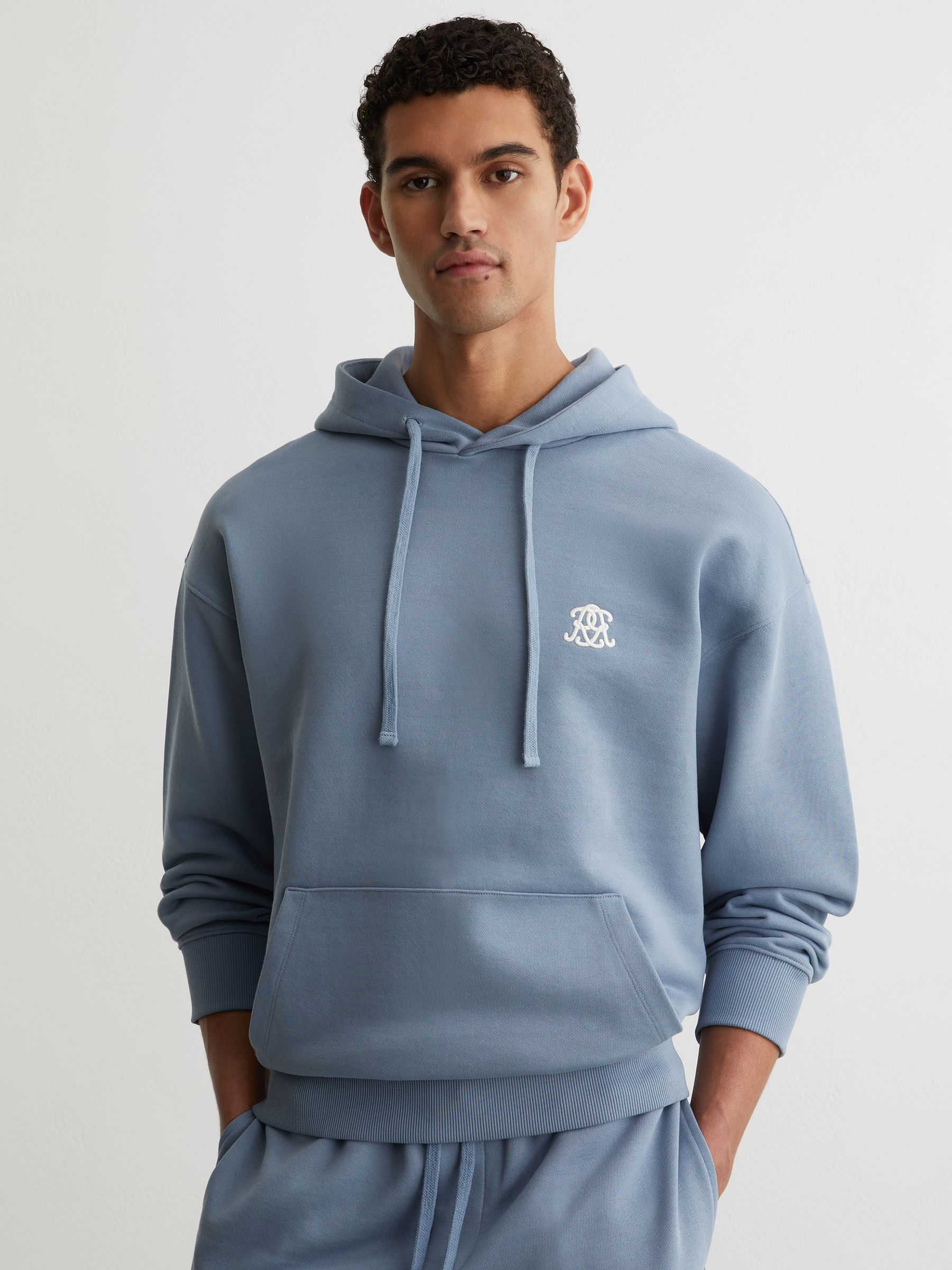 Monogram Embroidered Relaxed Hoodie in Powder Blue - Image 1 of 7 Monogram Embroidered Relaxed Hoodie in Powder Blue - Image 1 of 7