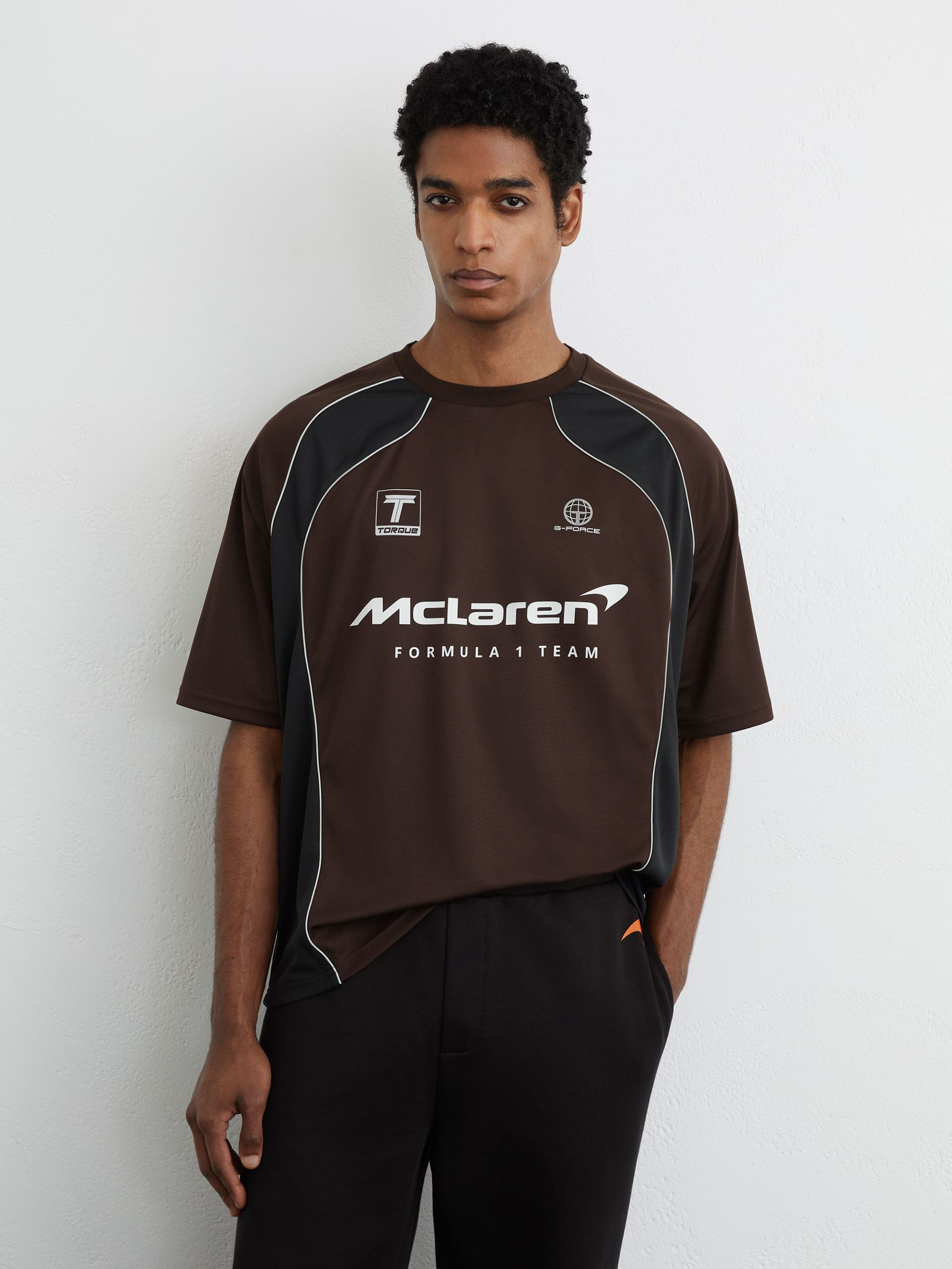 McLaren Racing Relaxed Contrast Driver T-Shirt Unisex-Fit in Chocolate Brown - Image 1 of 10