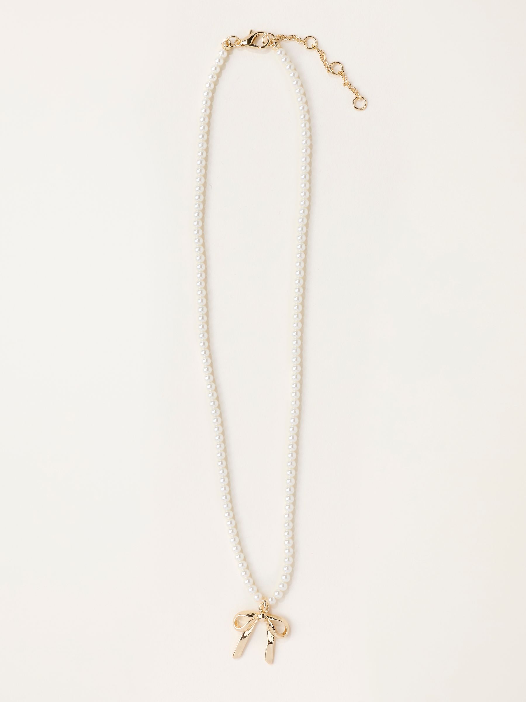 Gold Tone Bow Necklace - Image 1 of 3 Gold Tone Bow Necklace - Image 1 of 3