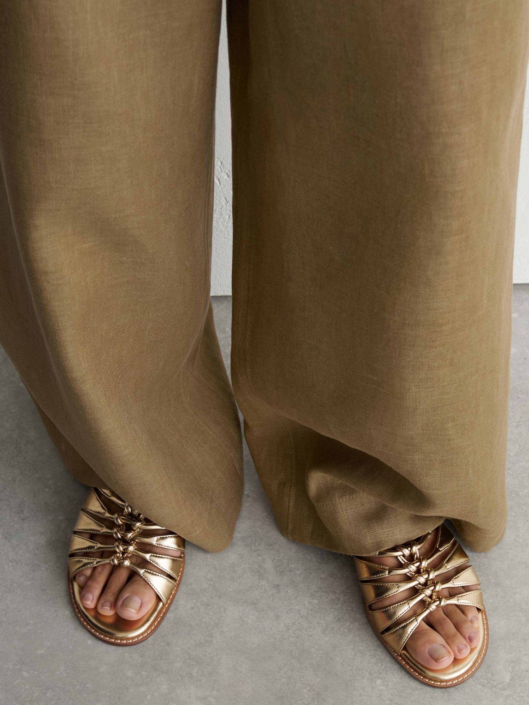 Leather Metallic Knotted Flat Sandals in Gold - Image 1 of 6 Leather Metallic Knotted Flat Sandals in Gold - Image 1 of 6