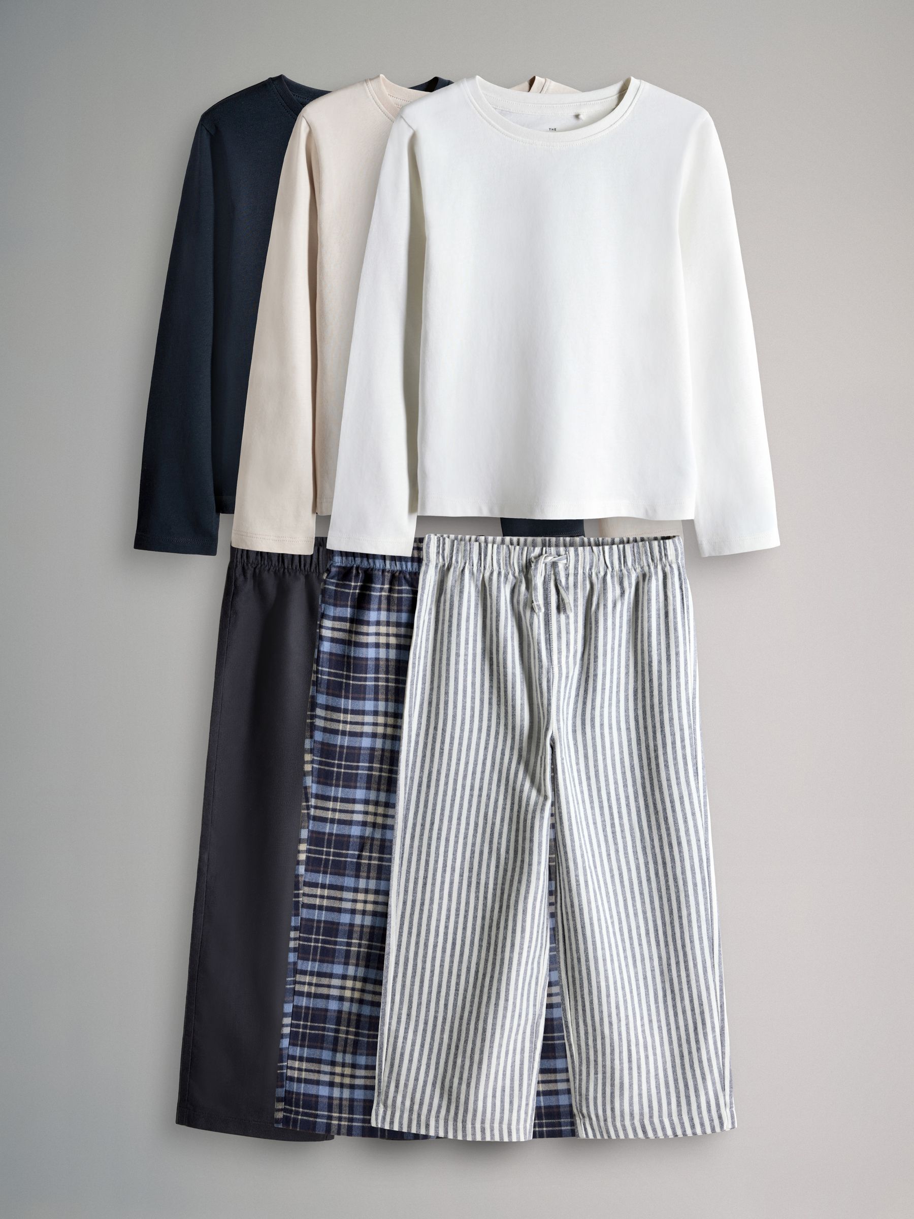 Navy Blue/Cream/Check 3 Pack Long Sleeve Cotton Jersey T-Shirt and Woven Bottom Pyjamas Set 3 Pack - Image 1 of 6 Navy Blue/Cream/Check 3 Pack Long Sleeve Cotton Jersey T-Shirt and Woven Bottom Pyjamas Set 3 Pack - Image 1 of 6