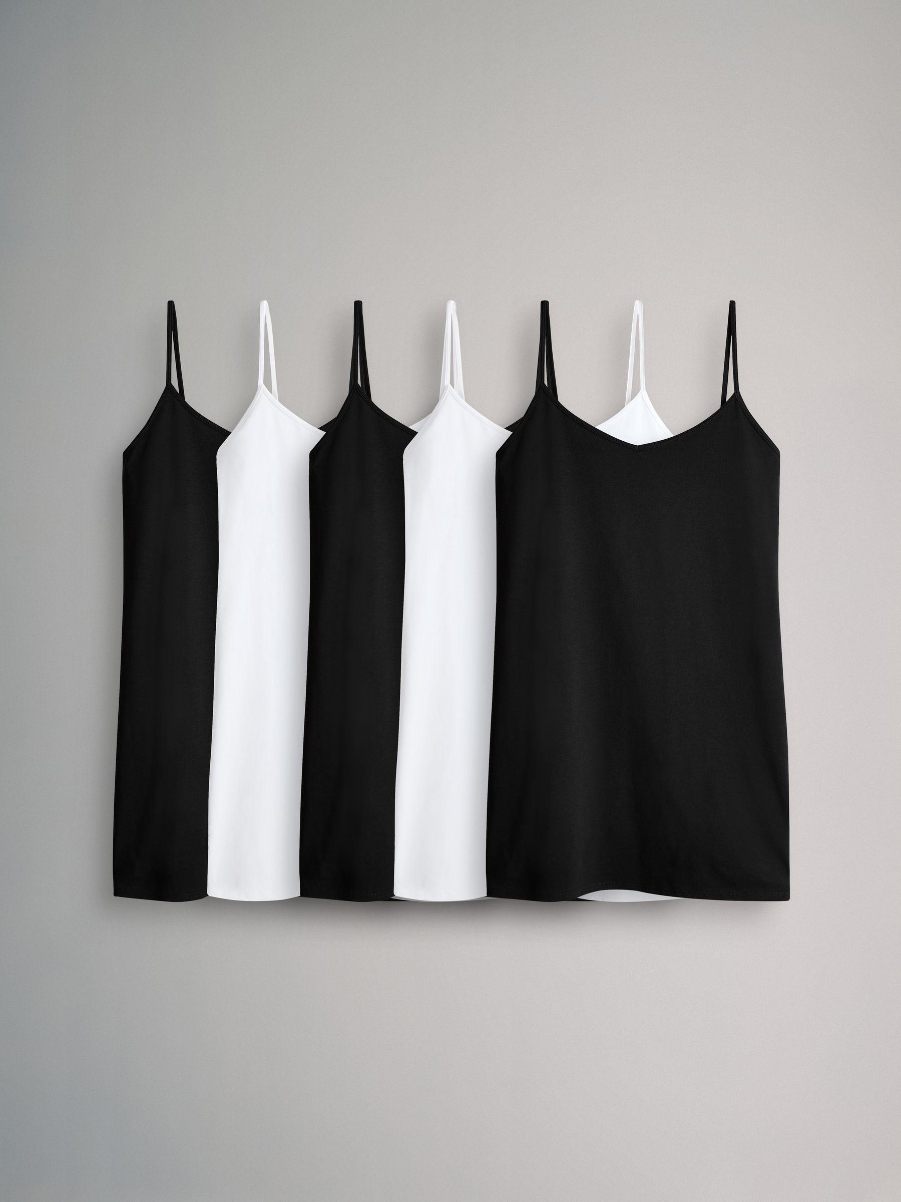 Black & White - 5 Pack Longline Thin Strap Vest Tops - Image 1 of 8 Black & White - 5 Pack Longline Thin Strap Vest Tops - Image 1 of 8
